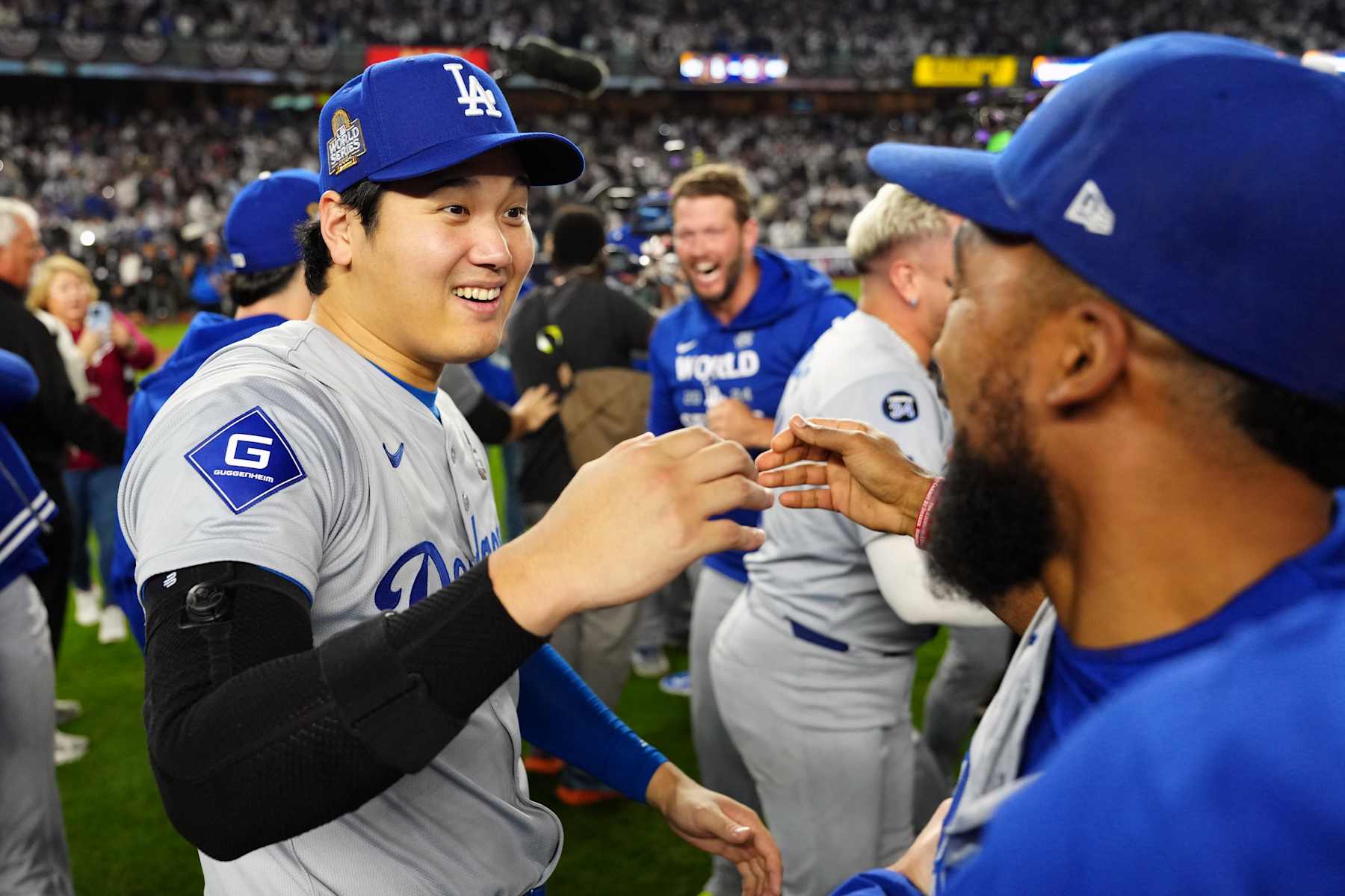 NEW YORK, NY - OCTOBER 30:  Shohei Ohtani #17 of the Los Angeles Dodgers celebrates with teammates after the Dodgers defeated the New York Yankees in Game 5 to clinch the 2024 World Series presented by Capital One at Yankee Stadium on Wednesday, October 30, 2024 in New York, New York. (Photo by Mary DeCicco/MLB Photos via Getty Images)