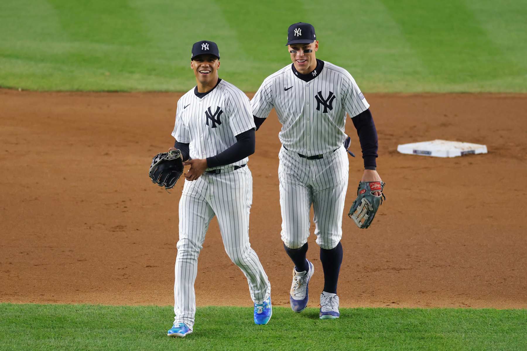 NEW YORK, NEW YORK - OCTOBER 14:  Juan Soto #22 of the New York Yankees jokes with Aaron Judge #99 during the 4th inning of Game One of the American League Championship Series against the Cleveland Guardians at Yankee Stadium on October 14, 2024 in New York City. (Photo by Mike Stobe/Getty Images)
