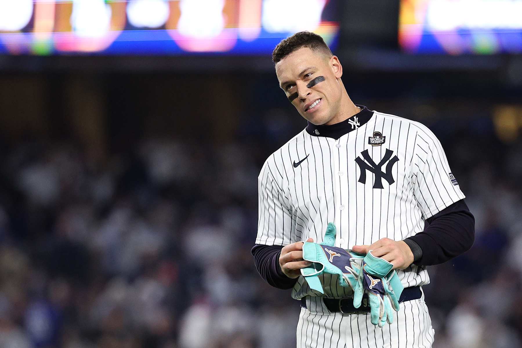 NEW YORK, NEW YORK - OCTOBER 30:  Aaron Judge #99 of the New York Yankees walks off the field after being left on base during the eighth inning of Game Five of the 2024 World Series against the Los Angeles Dodgers at Yankee Stadium on October 30, 2024 in the Bronx borough of New York City. (Photo by Elsa/Getty Images)