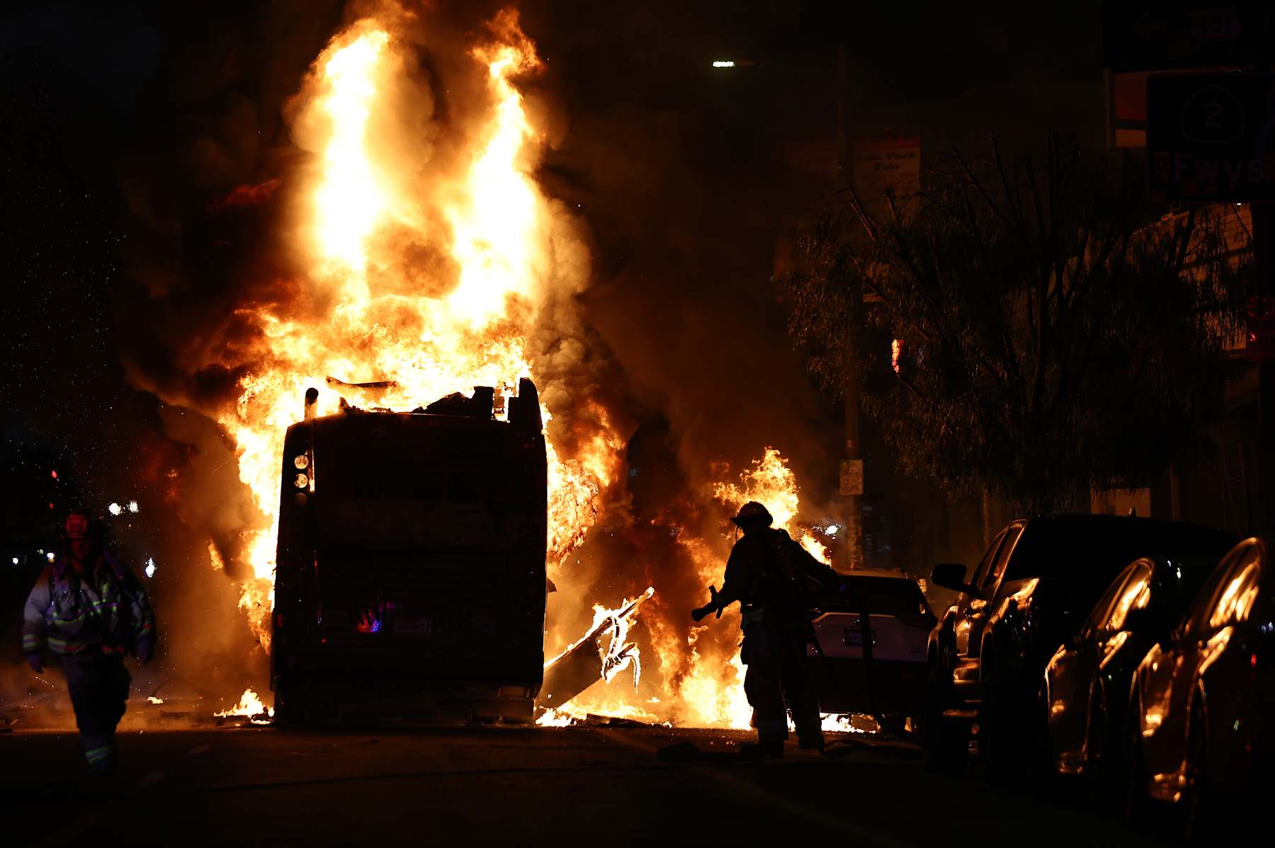 LOS ANGELES, CALIFORNIA - OCTOBER 31: A Metro bus bus burns following Dodger fan celebrations in the area after the Los Angeles Dodgers defeated the New York Yankees in Game 5 to win the World Series on October 31, 2024 in Los Angeles, California. The Dodgers plan to hold a victory parade on Friday. (Photo by Mario Tama/Getty Images)