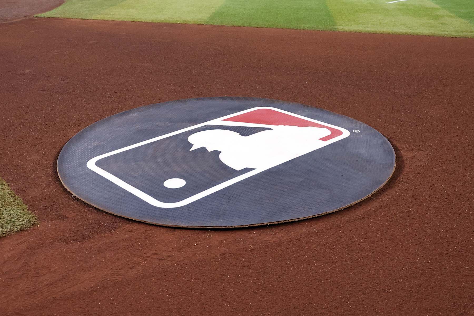 PHOENIX, ARIZONA - SEPTEMBER 10: The MLB logo is seen in the visitor's on deck circle during the game between the Arizona Diamondbacks and the Texas Rangers at Chase Field on September 10, 2024 in Phoenix, Arizona. The Diamondbacks defeated the Rangers 6-0. (Photo by Chris Coduto/Getty Images)