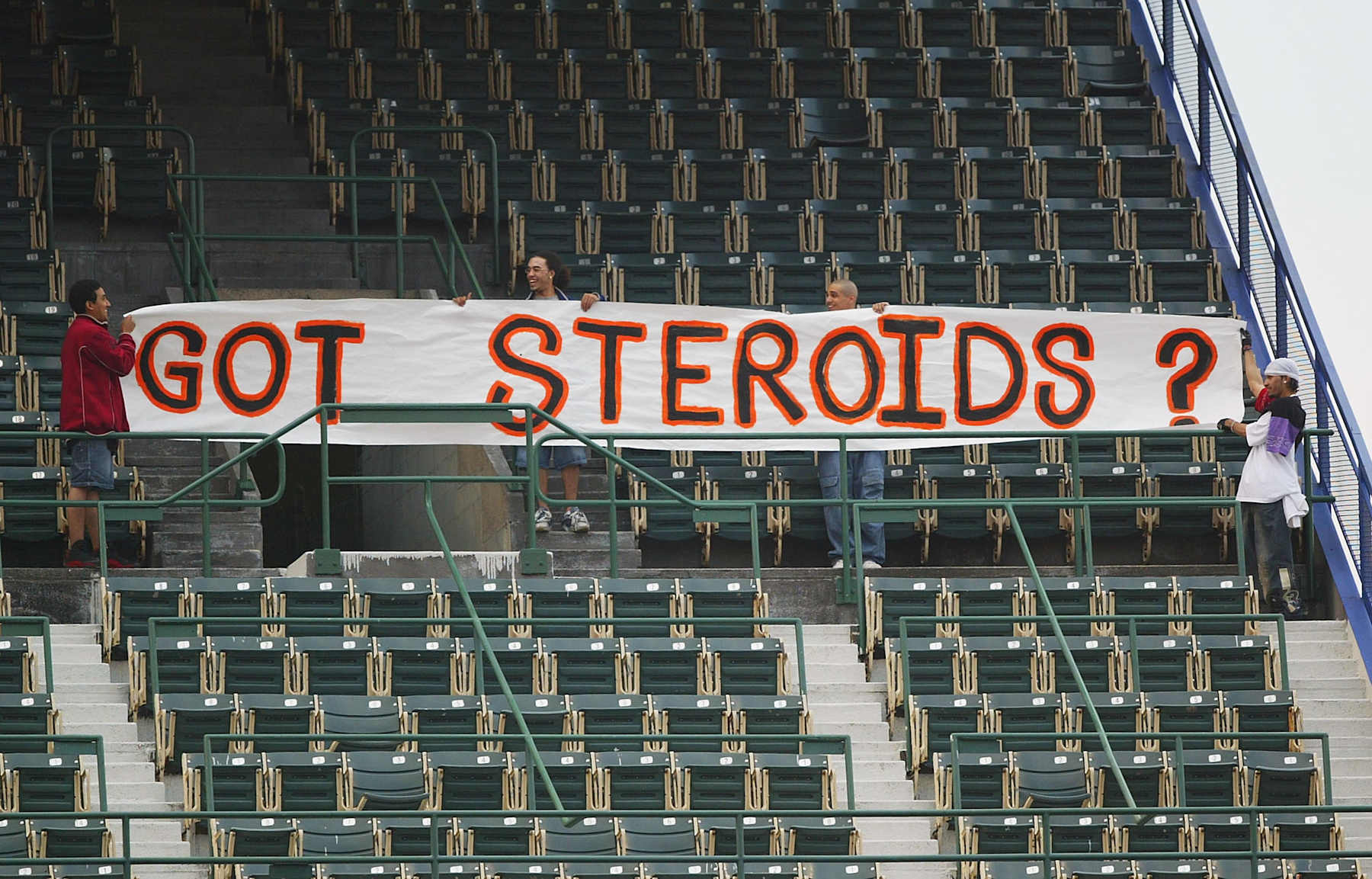 NEW YORK - MAY 5: Fans hold up a sign which reads 'Got Steroids?' during the game between the New York Mets and the San Fransisco Giants during their game on May 5, 2004 at Shea Stadium in Flushing, New York. The sign is in support alligations that Barry Bonds of the Giants took steroids which he got from the BALCO company which is currently under a federal drug investigation. (Photo by Al Bello/Getty Images)