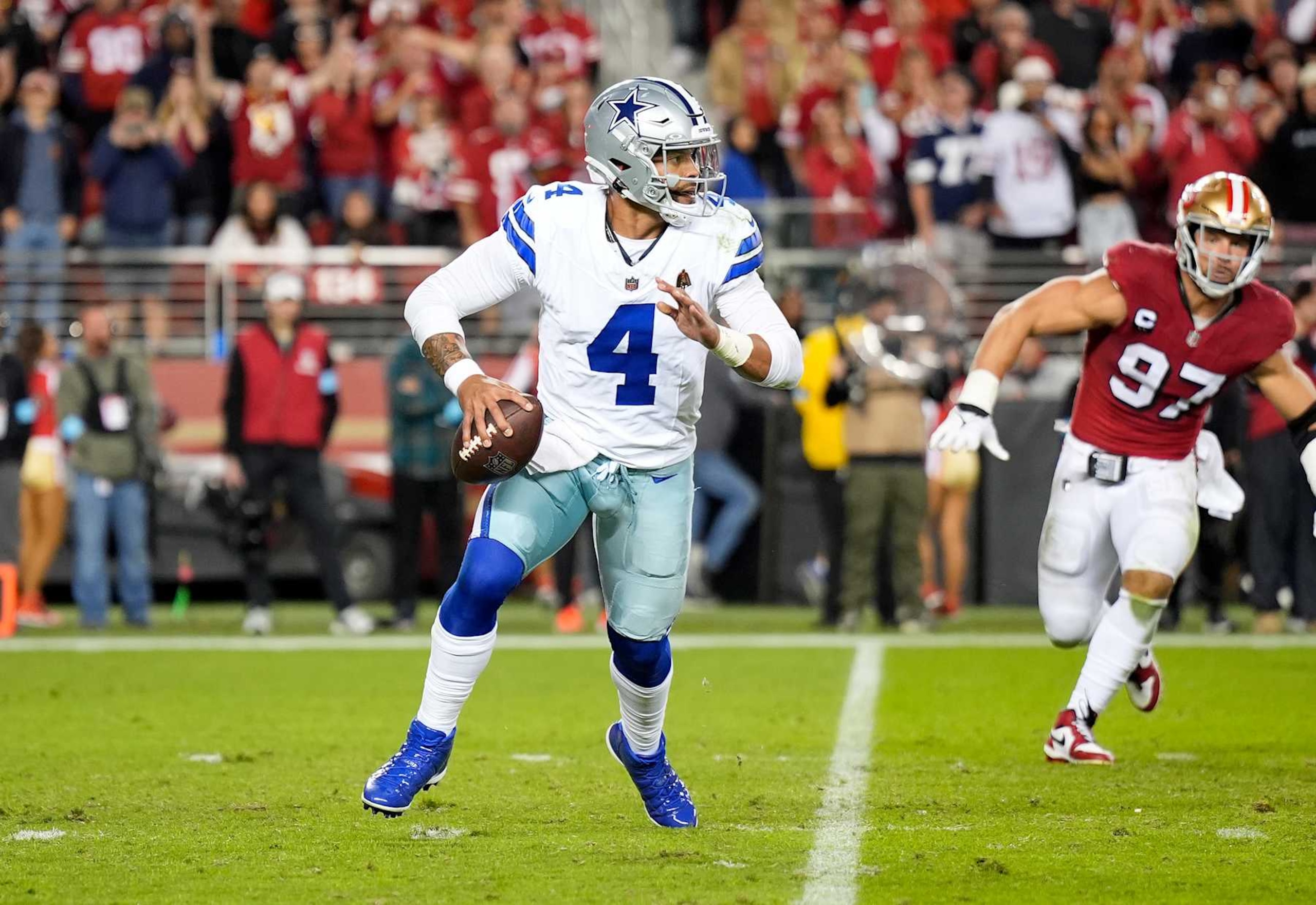 SANTA CLARA, CALIFORNIA - OCTOBER 27: Dak Prescott #4 of the Dallas Cowboys scrambling with the ball throws a pass against the San Francisco 49ers during the fourth quarter of an NFL football game at Levi's Stadium on October 27, 2024 in Santa Clara, California. (Photo by Thearon W. Henderson/Getty Images)