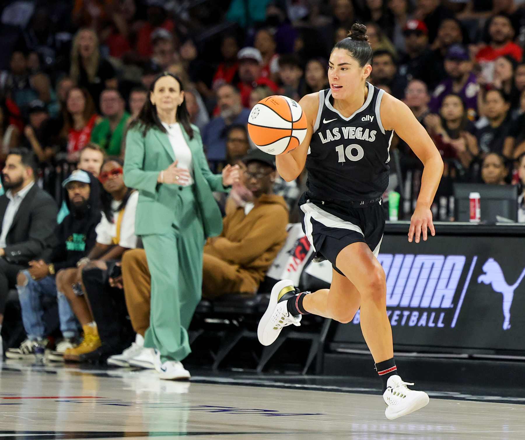LAS VEGAS, NEVADA - OCTOBER 06: Kelsey Plum #10 of the Las Vegas Aces brings the ball up the court against the New York Liberty in the first quarter of Game Four of the 2024 WNBA Playoffs semifinals at Michelob ULTRA Arena on October 06, 2024 in Las Vegas, Nevada. The Liberty defeated the Aces 76-62 to win the series three games to one. NOTE TO USER: User expressly acknowledges and agrees that, by downloading and or using this photograph, User is consenting to the terms and conditions of the Getty Images License Agreement. (Photo by Ethan Miller/Getty Images)