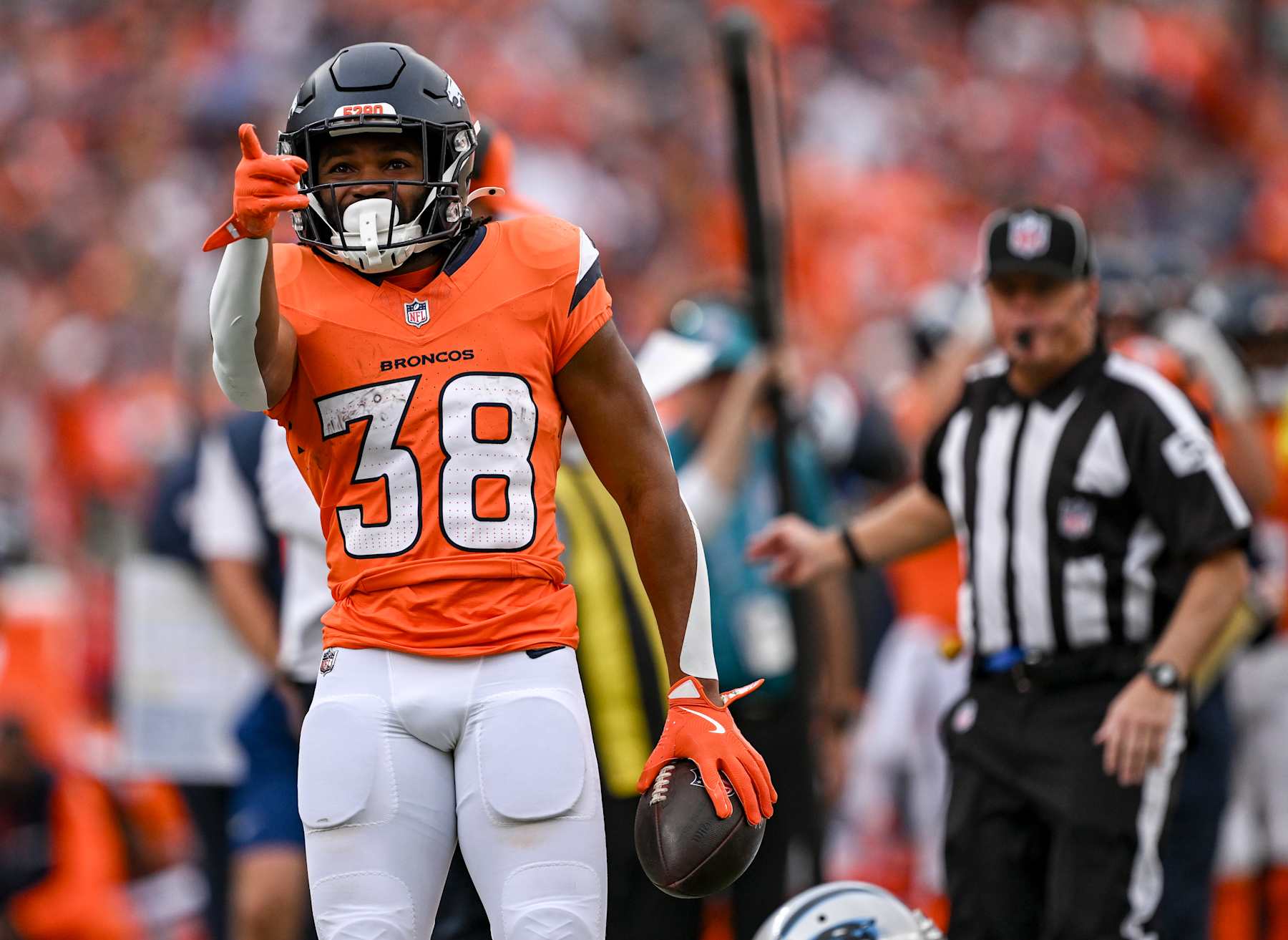 DENVER, CO - OCTOBER 27: Jaleel McLaughlin (38) of the Denver Broncos points to indicate a first down against the Carolina Panthers during the second quarter at Empower Field at Mile High in Denver on Sunday, October 27, 2024. (Photo by AAron Ontiveroz/The Denver Post)
