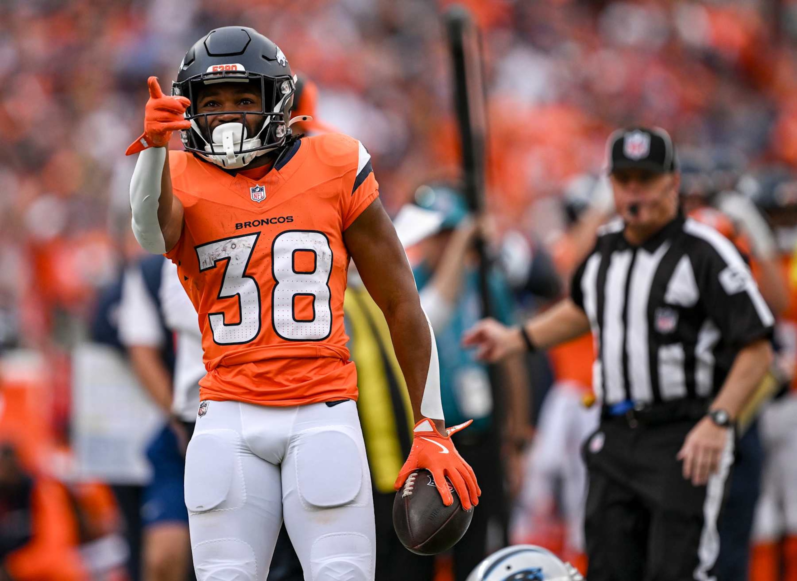 DENVER, CO - OCTOBER 27: Jaleel McLaughlin (38) of the Denver Broncos points to indicate a first down against the Carolina Panthers during the second quarter at Empower Field at Mile High in Denver on Sunday, October 27, 2024. (Photo by AAron Ontiveroz/The Denver Post)