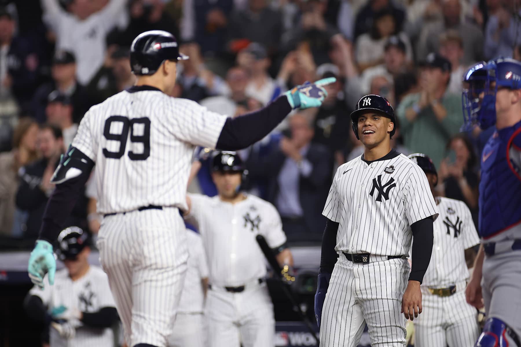 NEW YORK, NEW YORK - OCTOBER 30: Juan Soto #22 of the New York Yankees waits to congratulate Aaron Judge #99 after Judge hit a two-run home run during the first inning of Game Five of the 2024 World Series against the Los Angeles Dodgers at Yankee Stadium on October 30, 2024 in the Bronx borough of New York City. (Photo by Sarah Stier/Getty Images)