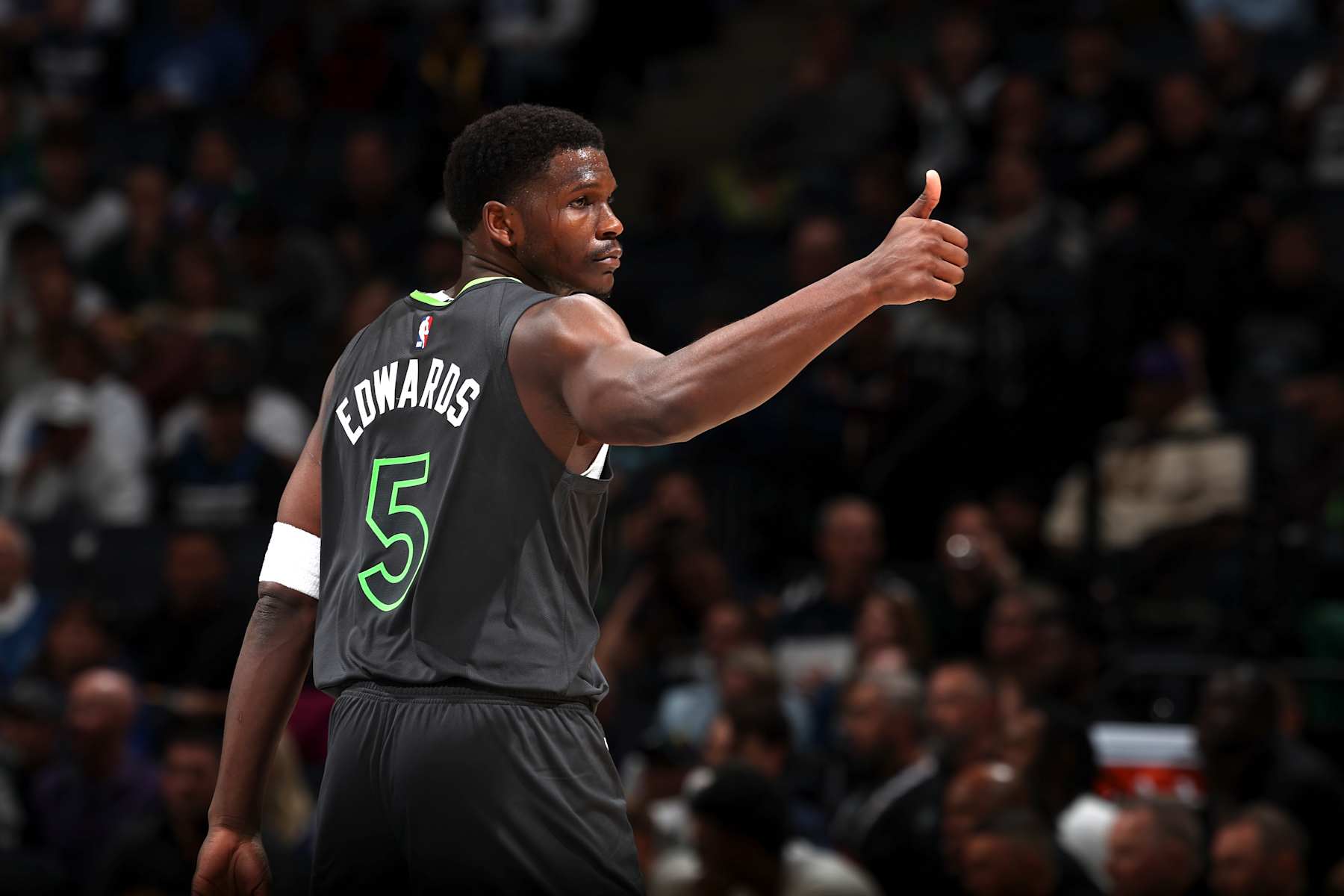 MINNEAPOLIS, MN -  NOVEMBER 1: Anthony Edwards #5 of the Minnesota Timberwolves looks on during the game against the Denver Nuggets on November 1, 2024 at Target Center in Minneapolis, Minnesota. NOTE TO USER: User expressly acknowledges and agrees that, by downloading and or using this Photograph, user is consenting to the terms and conditions of the Getty Images License Agreement. Mandatory Copyright Notice: Copyright 2024 NBAE (Photo by David Sherman/NBAE via Getty Images)