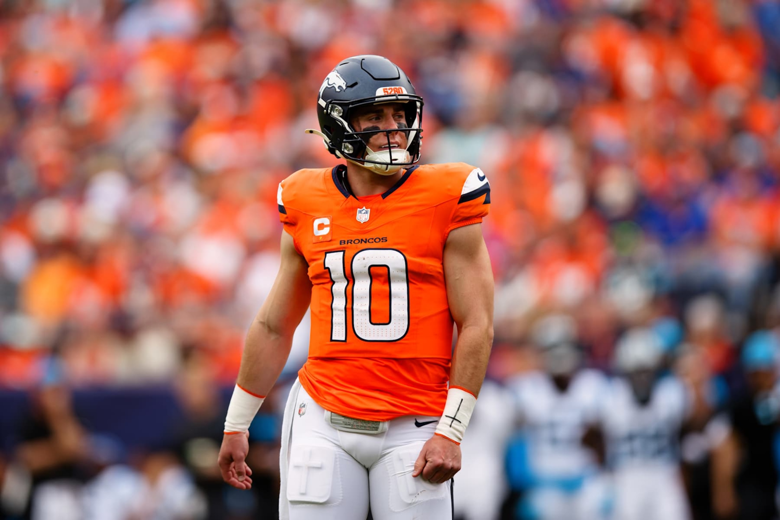 DENVER, CO - OCTOBER 27:  Quarterback Bo Nix #10 of the Denver Broncos looks on from the field during the second quarter against the Carolina Panthers at Empower Field at Mile High on October 27, 2024 in Denver, Colorado. (Photo by Justin Edmonds/Getty Images)