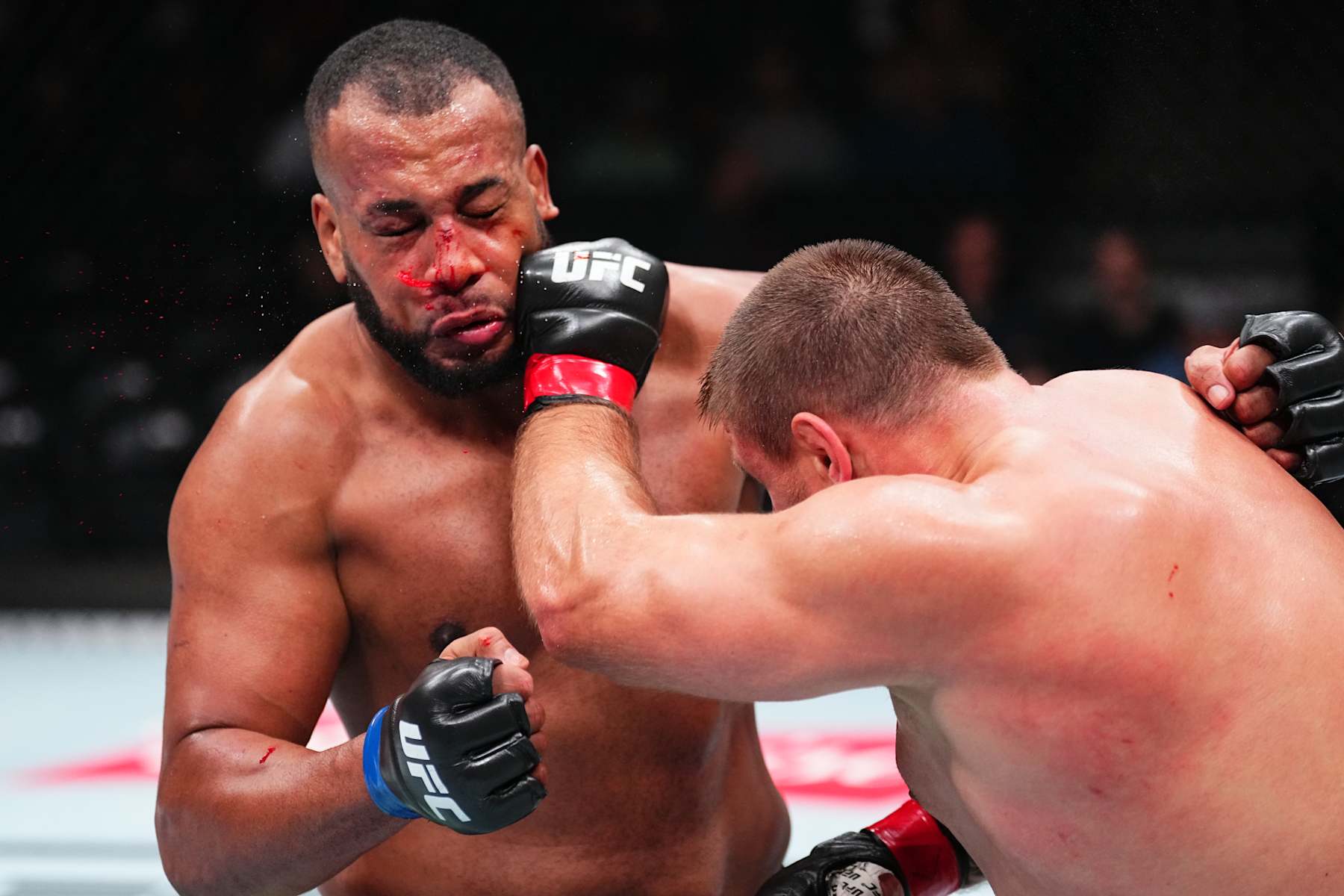 EDMONTON, ALBERTA - NOVEMBER 02: (R-L) Alexandr Romanov of Moldova punches Rodrigo Nascimento of Brazil in a heavyweight fight during the UFC Fight Night event at Rogers Place on November 02, 2024 in Edmonton, Alberta. (Photo by Jeff Bottari/Zuffa LLC)