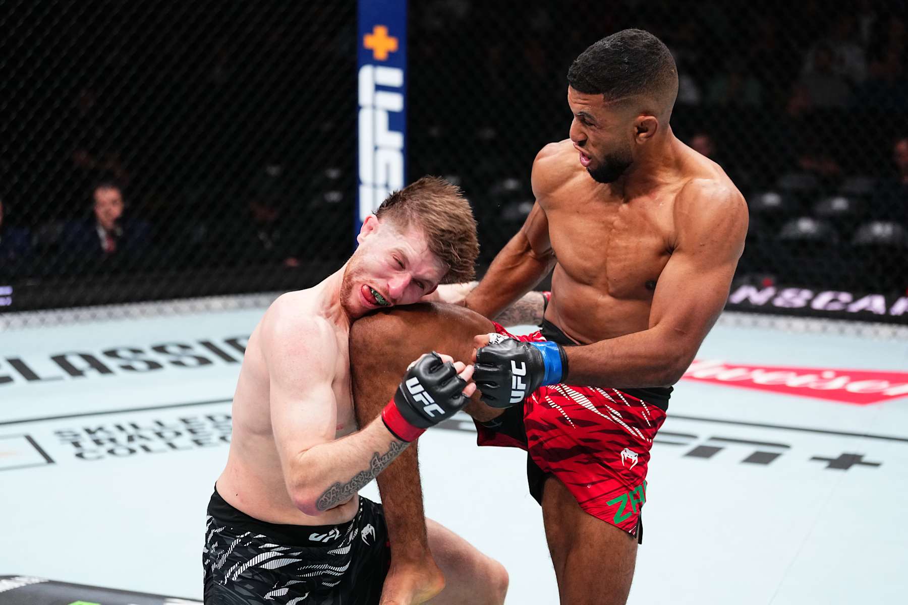EDMONTON, ALBERTA - NOVEMBER 02: (R-L) Youssef Zalal of Morocco knees Jack Shore of Wales in a featherweight fight during the UFC Fight Night event at Rogers Place on November 02, 2024 in Edmonton, Alberta. (Photo by Jeff Bottari/Zuffa LLC)