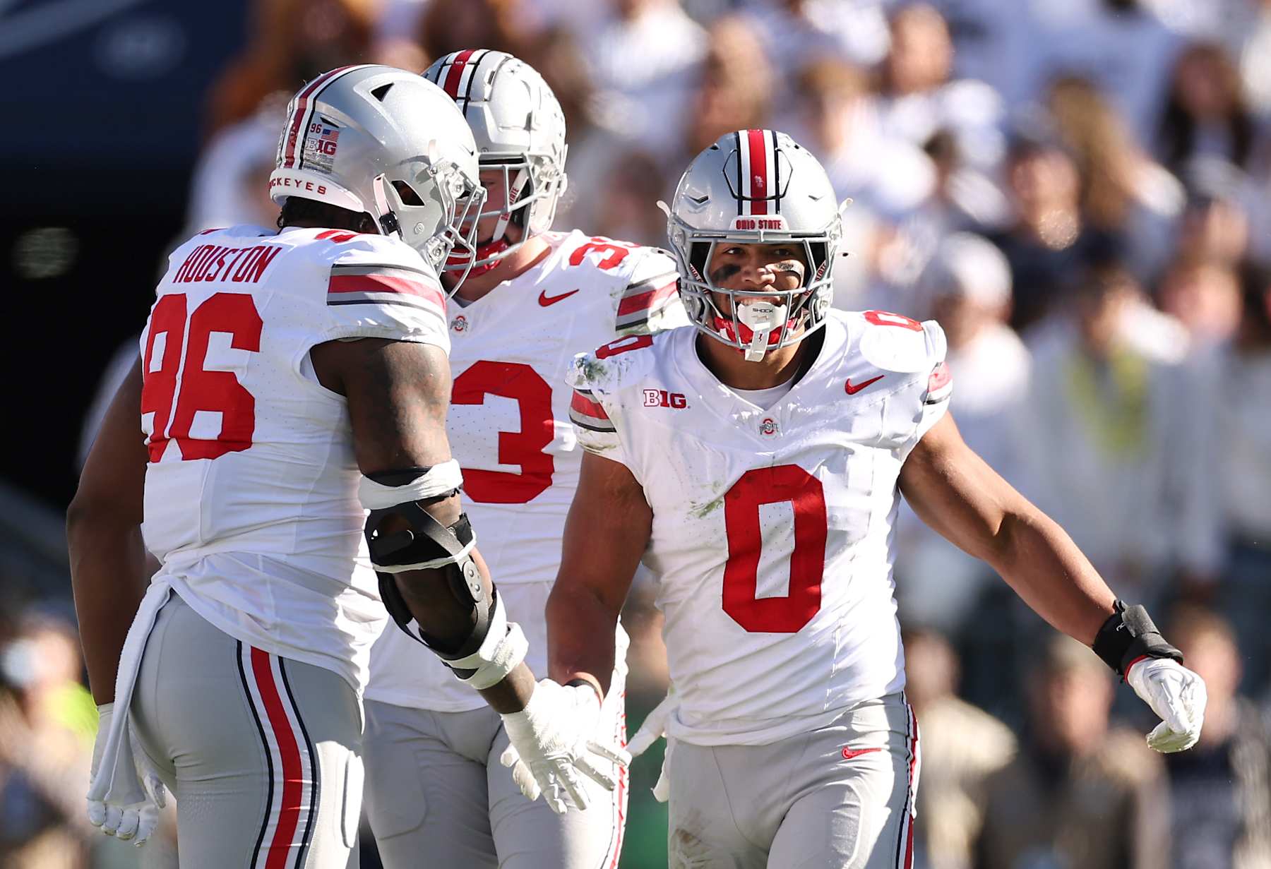 STATE COLLEGE, PENNSYLVANIA - NOVEMBER 02: Cody Simon #0 of the Ohio State Buckeyes celebrates with teammates after sacking Drew Allar #15 of the Penn State Nittany Lions during the third quarter at Beaver Stadium on November 02, 2024 in State College, Pennsylvania. Ohio State defeated Penn State 20-13 (Photo by Scott Taetsch/Getty Images)