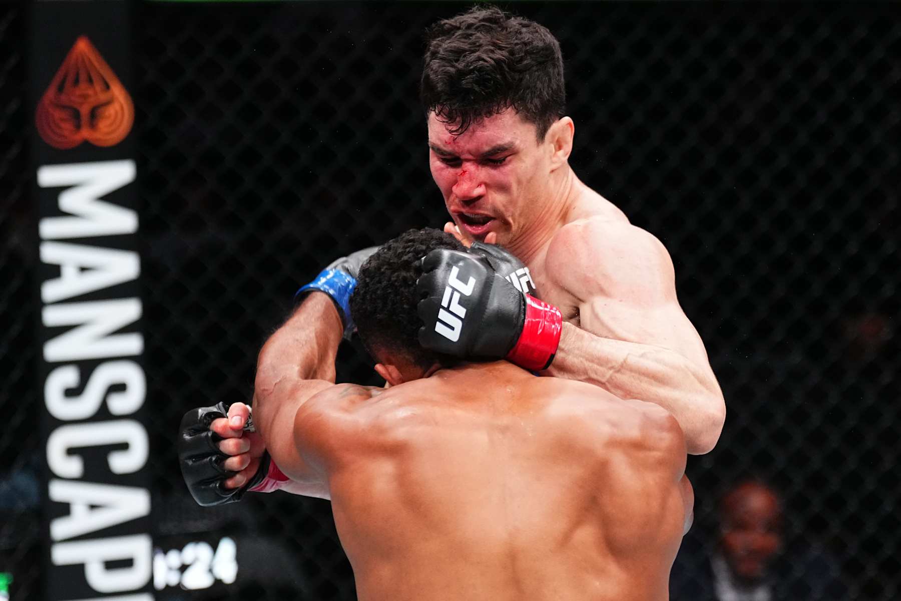 EDMONTON, ALBERTA - NOVEMBER 02: (R-L) Mike Malott punches Trevin Giles in a welterweight fight during the UFC Fight Night event at Rogers Place on November 02, 2024 in Edmonton, Alberta. (Photo by Jeff Bottari/Zuffa LLC)