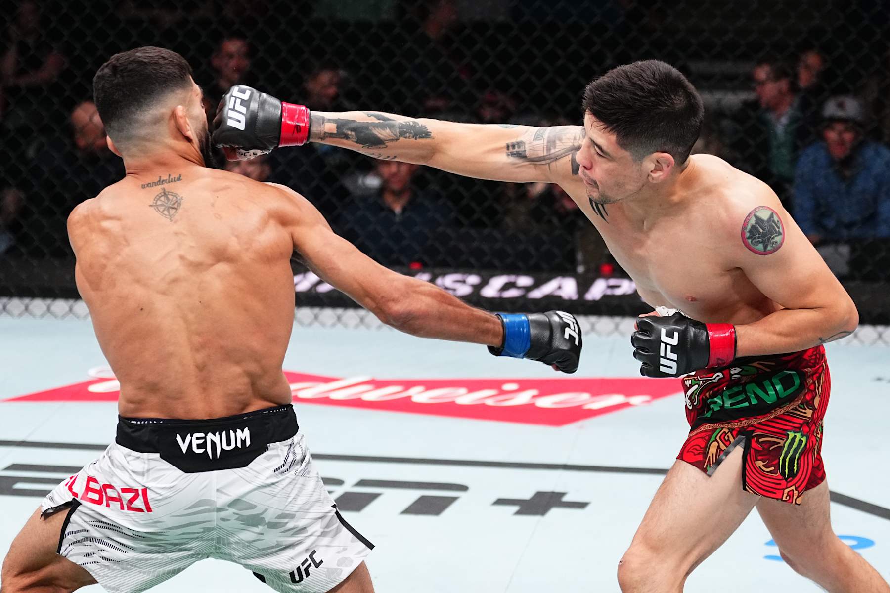 EDMONTON, ALBERTA - NOVEMBER 02: (R-L) Brandon Moreno of Mexico punches Amir Albazi of Iraq in a flyweight fight during the UFC Fight Night event at Rogers Place on November 02, 2024 in Edmonton, Alberta. (Photo by Jeff Bottari/Zuffa LLC)