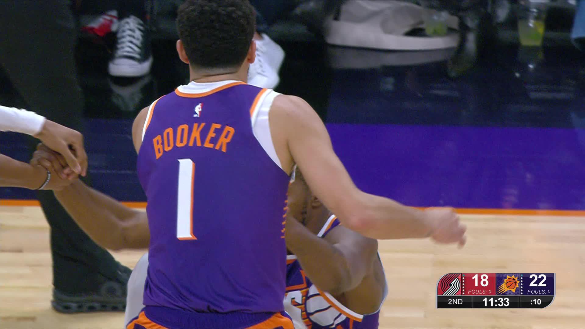 Phoenix Suns players huddling together before the game