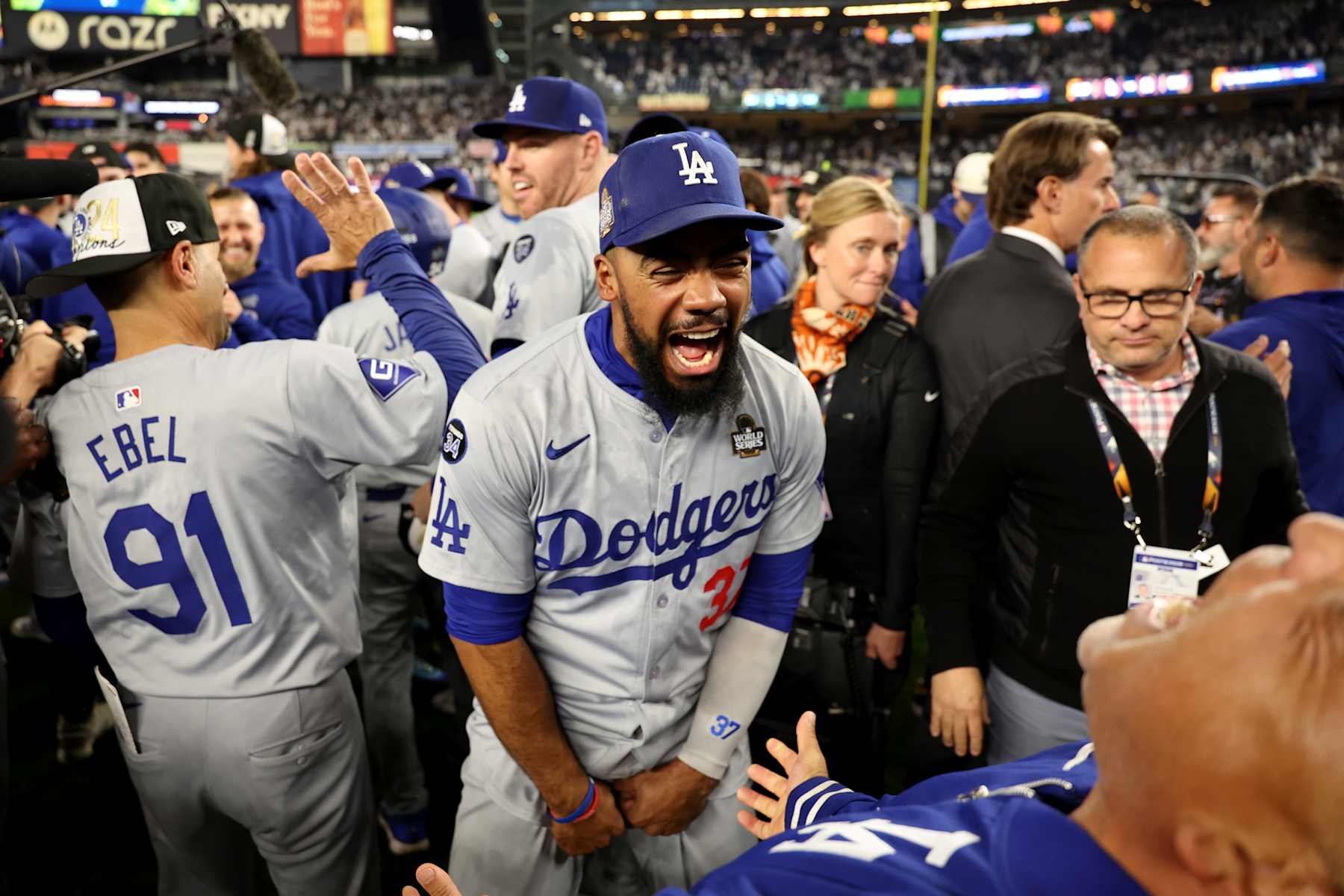 BRONX, NEW YORK - OCTOBER 30, 2024: Los Angeles Dodgers outfielder Teoscar Hernández (37), center, celebrates on the field. Game 5 of the World Series against the Yankees at Yankees Stadium in New York City Wednesday, October 30 2024. (Robert Gauthier/Los Angeles Times via Getty Images)