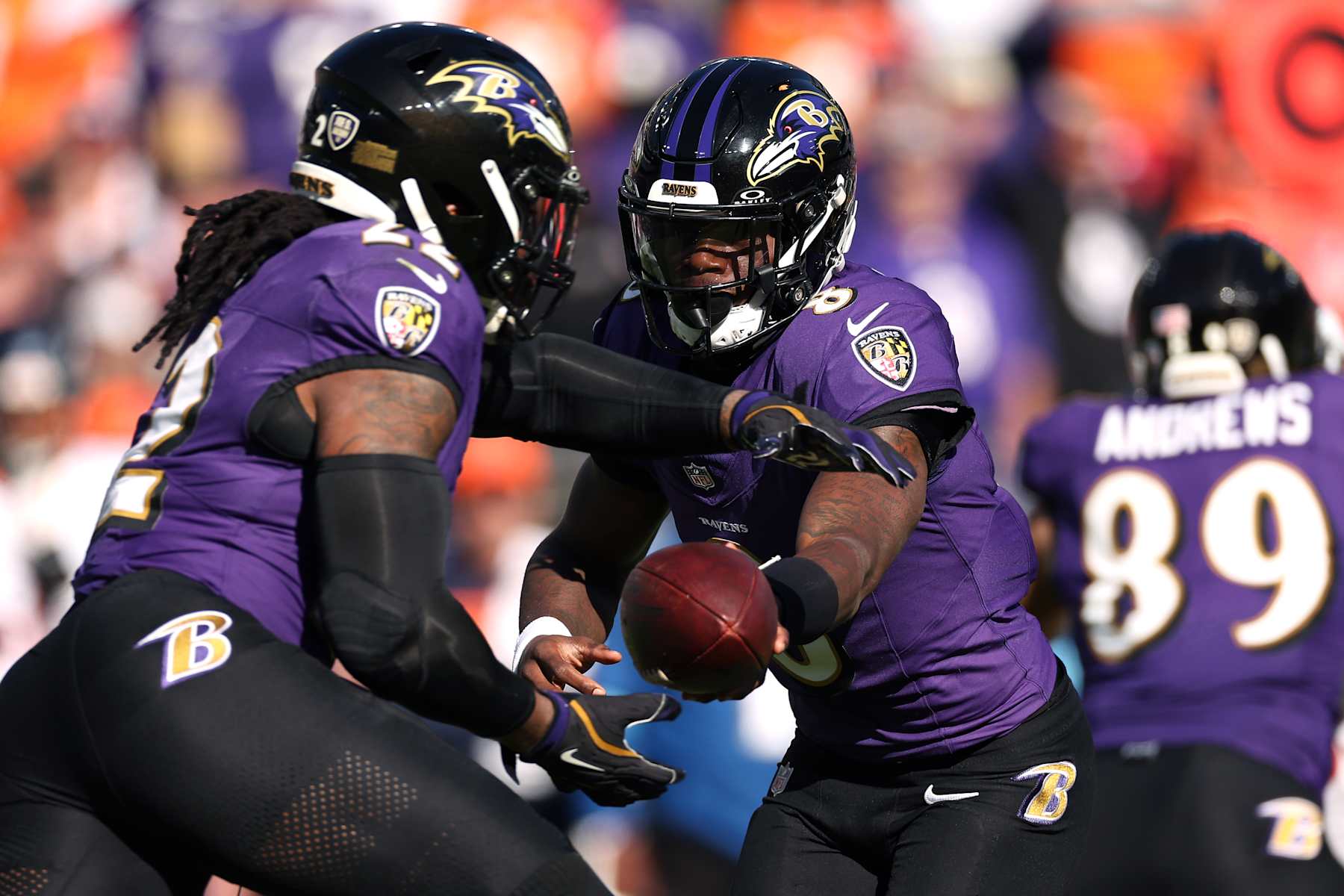 BALTIMORE, MARYLAND - NOVEMBER 03: Lamar Jackson #8 hands the ball off to Derrick Henry #22 of the Baltimore Ravens in the first quarter of a game against the Denver Broncos at M&T Bank Stadium on November 03, 2024 in Baltimore, Maryland. (Photo by Scott Taetsch/Getty Images)