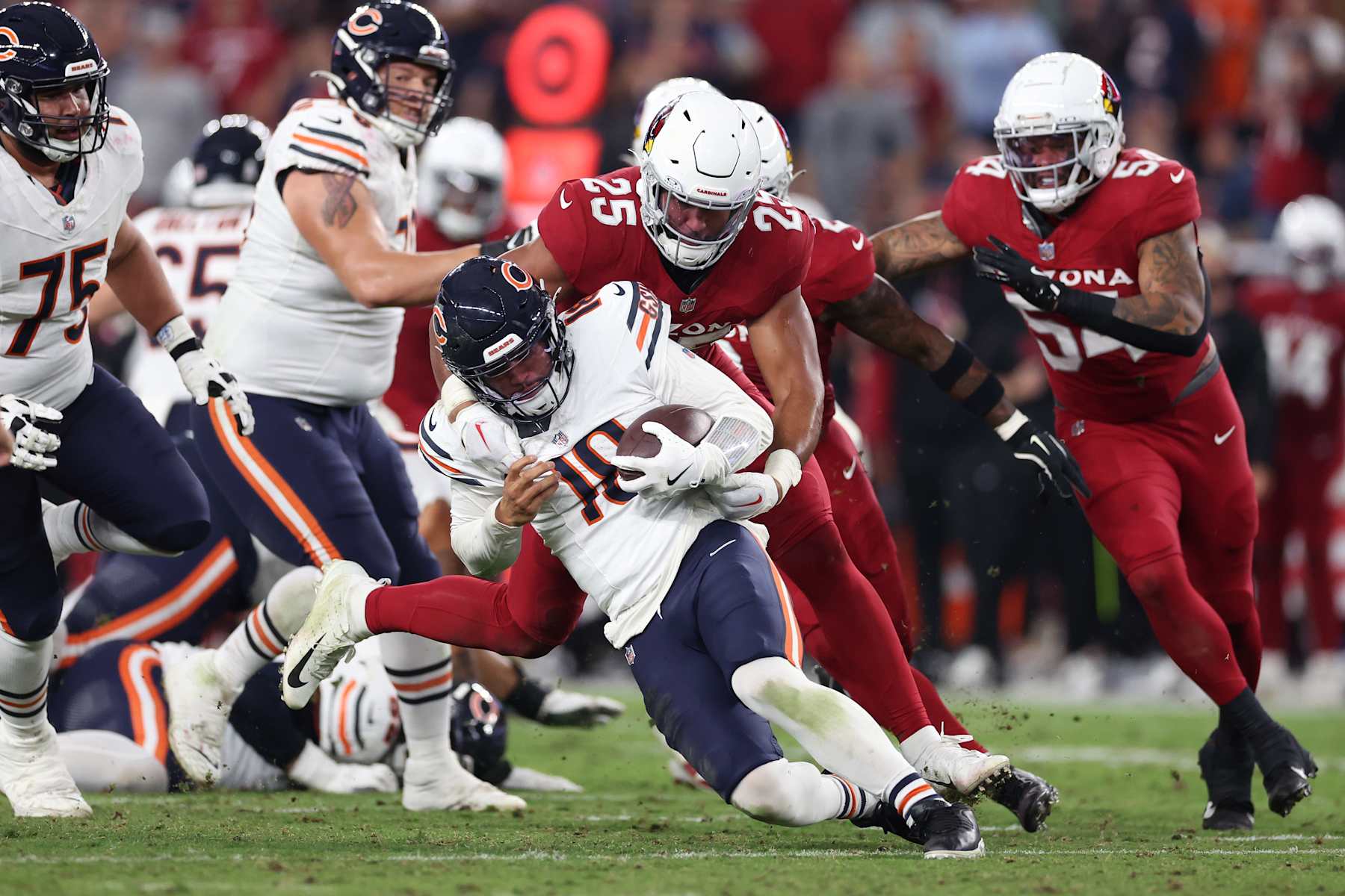 GLENDALE, ARIZONA - NOVEMBER 03: Zaven Collins #25 of the Arizona Cardinals sacks Caleb Williams #18 of the Chicago Bears in the fourth quarter of a game at State Farm Stadium on November 03, 2024 in Glendale, Arizona. (Photo by Christian Petersen/Getty Images)