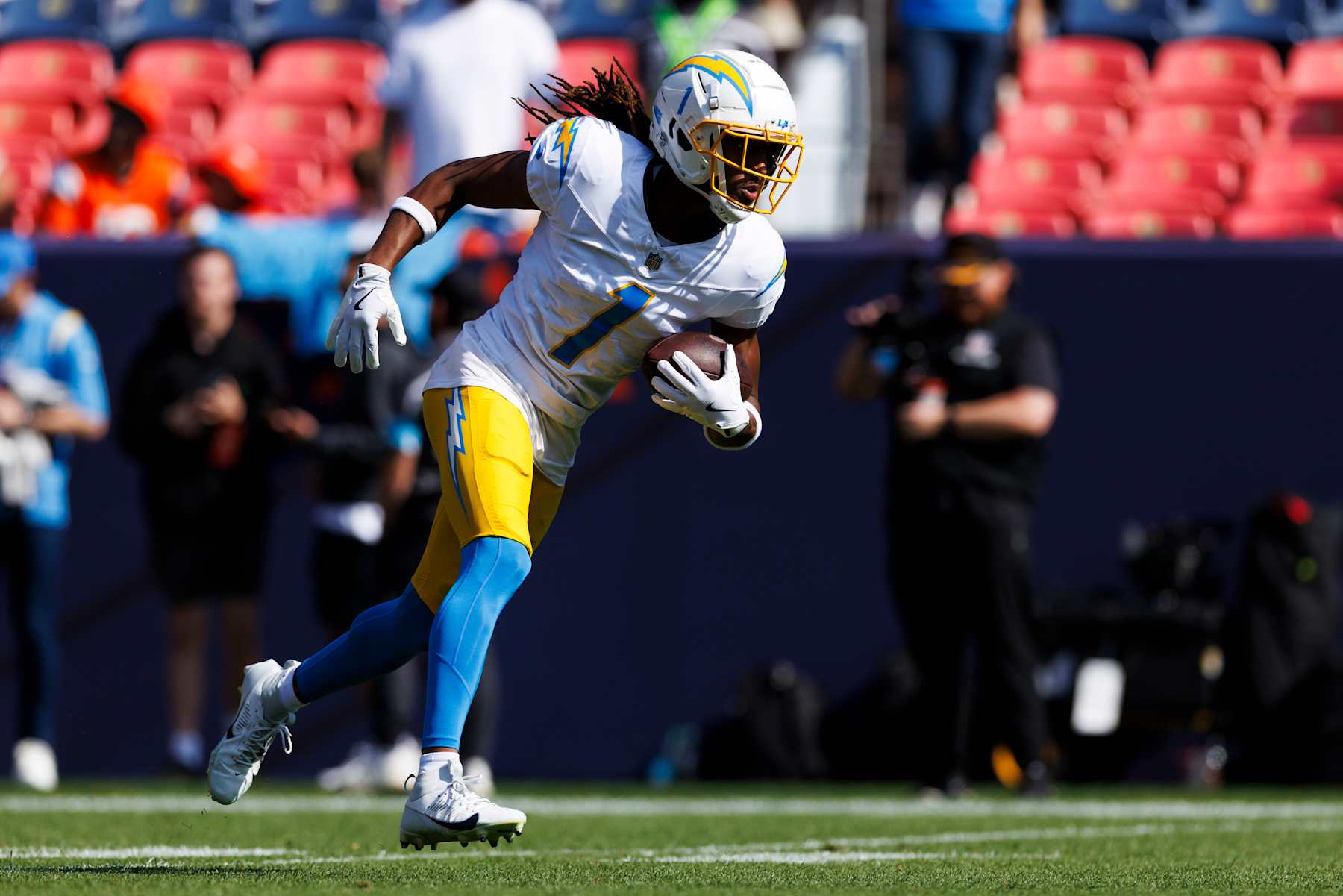 DENVER, COLORADO - OCTOBER 13: Quentin Johnston #1 of the Los Angeles Chargers runs after the catch during warmups before the game against the Denver Broncos at Empower Field At Mile High on October 13, 2024, in Denver, Colorado. (Photo by Ric Tapia/Getty Images)