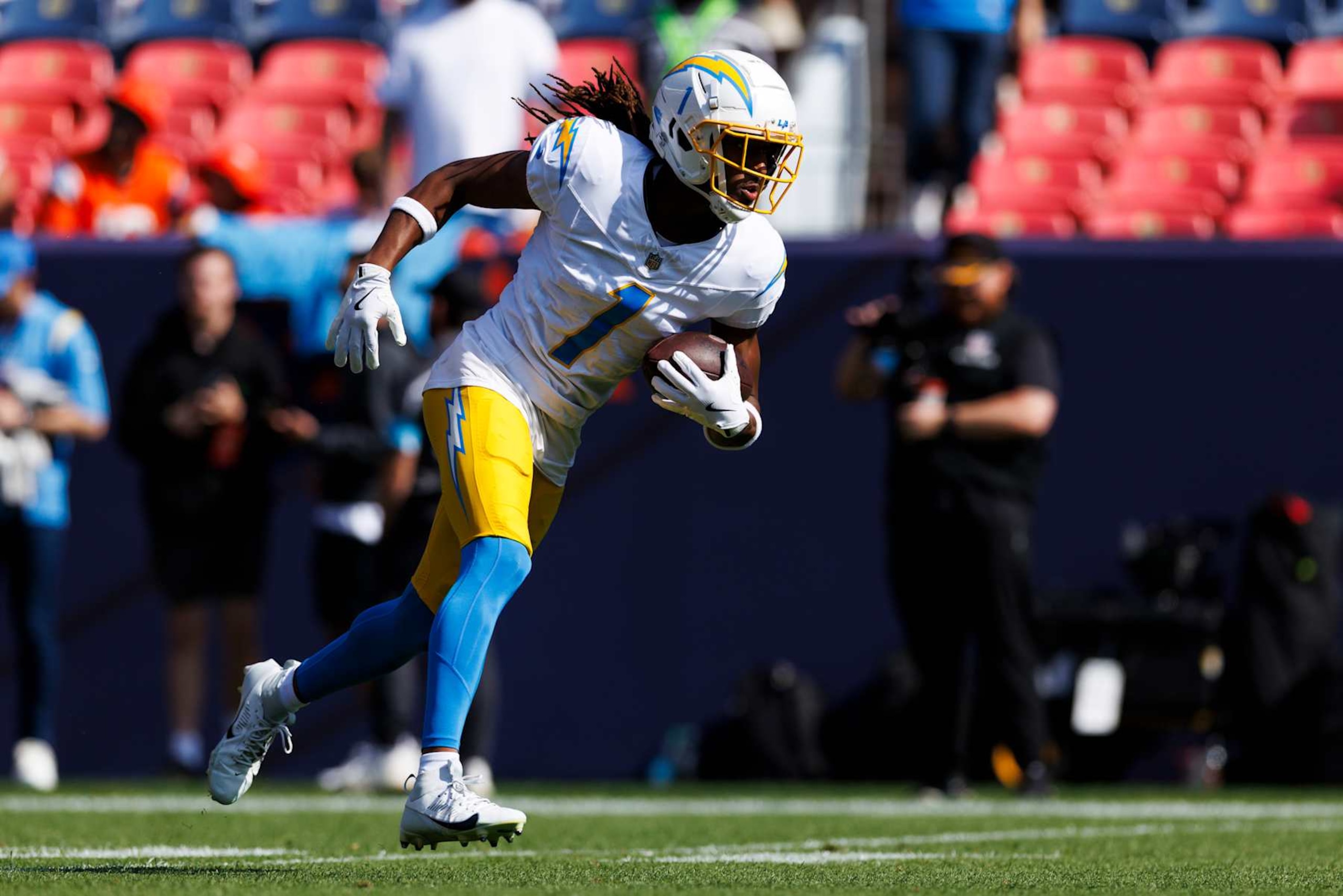 DENVER, COLORADO - OCTOBER 13: Quentin Johnston #1 of the Los Angeles Chargers runs after the catch during warmups before the game against the Denver Broncos at Empower Field At Mile High on October 13, 2024, in Denver, Colorado. (Photo by Ric Tapia/Getty Images) DENVER, COLORADO - OCTOBER 13: Quentin Johnston #1 of the Los Angeles Chargers runs after the catch during warmups before the game against the Denver Broncos at Empower Field At Mile High on October 13, 2024, in Denver, Colorado. (Photo by Ric Tapia/Getty Images)