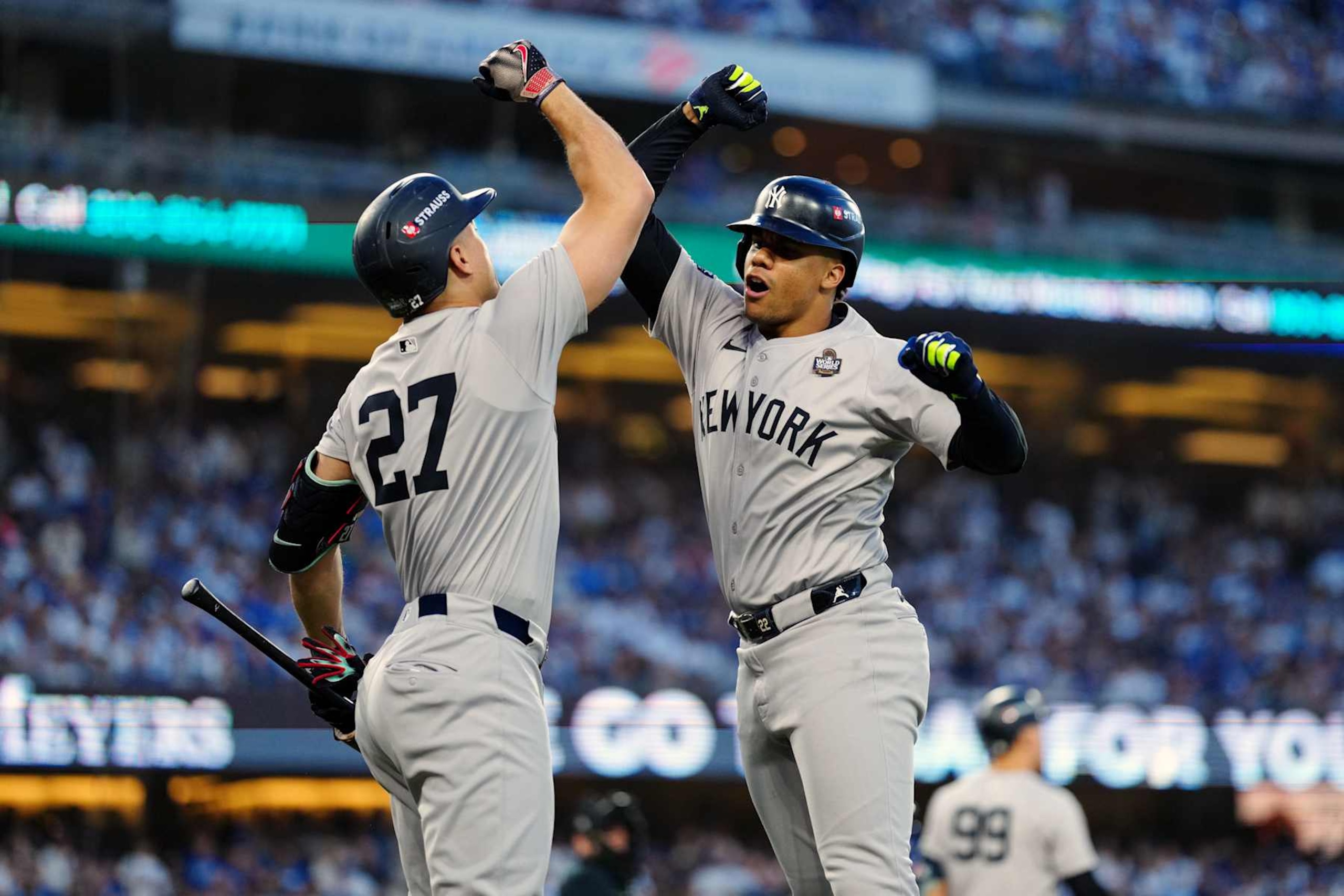 LOS ANGELES, CA - OCTOBER 26:  Juan Soto #22 of the New York Yankees celebrates with teammate Giancarlo Stanton #27 after hitting a solo home run in the third inning during Game 2 of the 2024 World Series presented by Capital One between the New York Yankees and the Los Angeles Dodgers at Dodger Stadium on Saturday, October 26, 2024 in Los Angeles, California. (Photo by Daniel Shirey/MLB Photos via Getty Images)