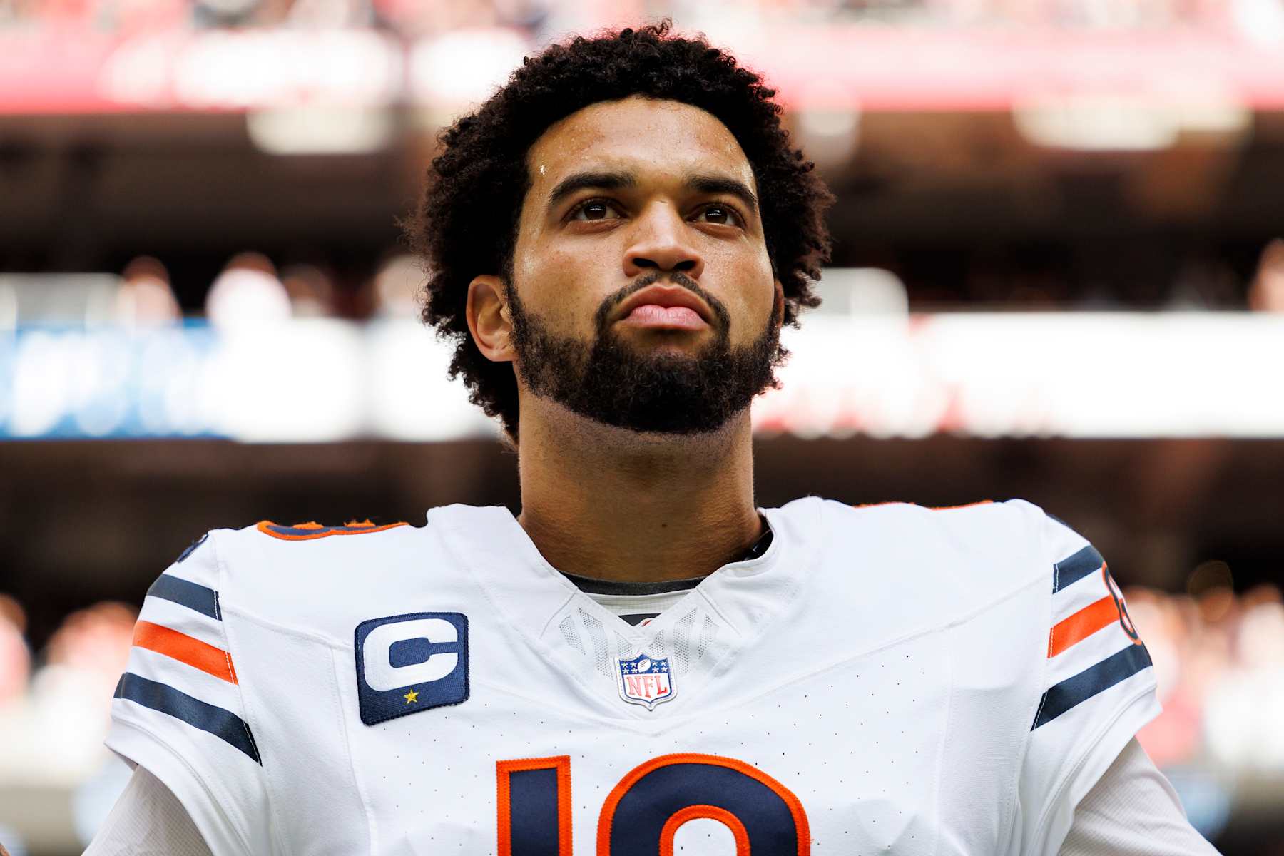 GLENDALE, ARIZONA - NOVEMBER 3: Quarterback Caleb Williams #18 of the Chicago Bears stands on the sidelines during the national anthem prior to an NFL game against the Arizona Cardinals at State Farm Stadium on November 3, 2024 in Glendale, Arizona. (Photo by Brooke Sutton/Getty Images)