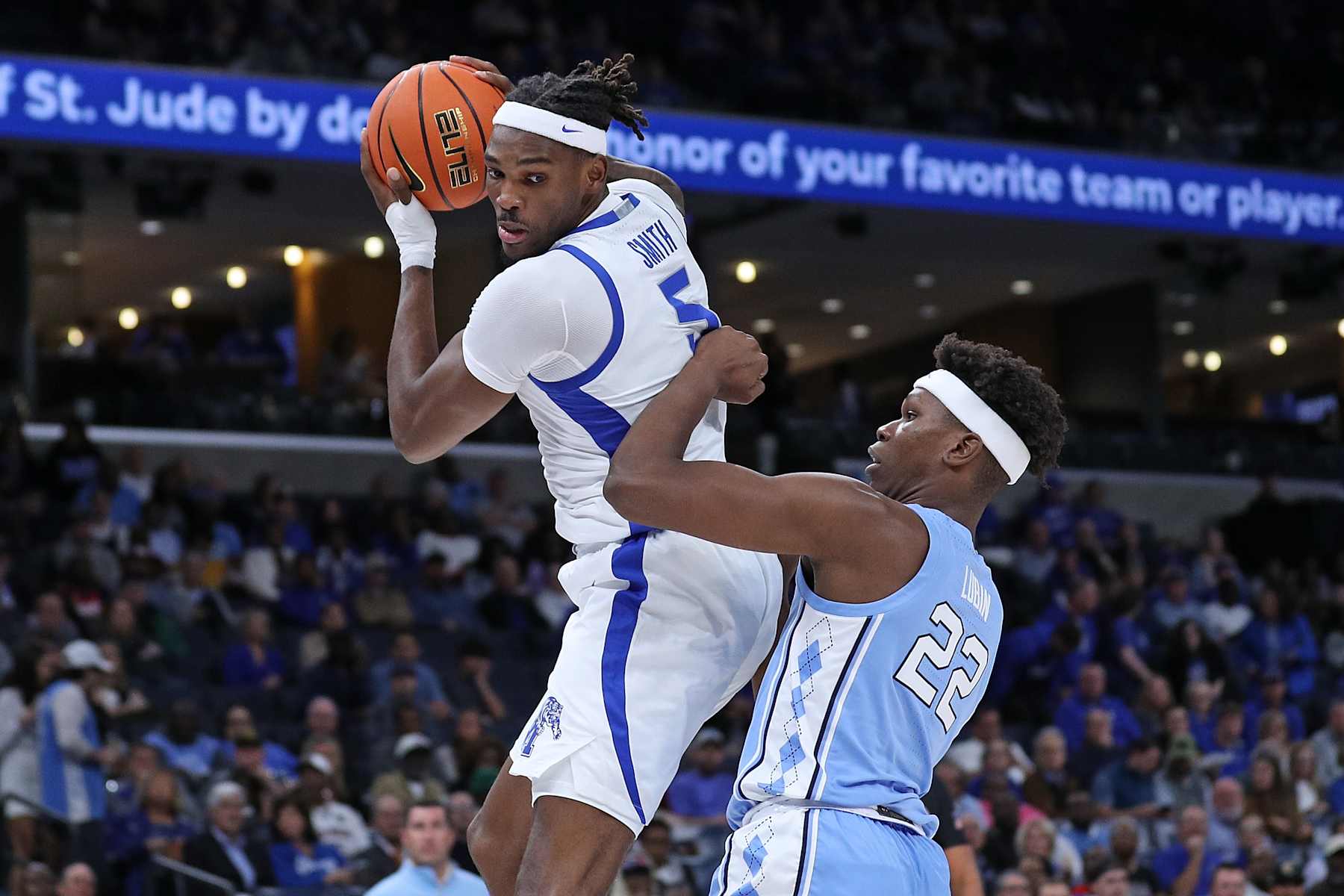 MEMPHIS, TENNESSEE - OCTOBER 15: Tyreek Smith #5 of the Memphis Tigers grabs the rebound against Ven-Allen Lubin #22 of the North Carolina Tar Heels during the first half of the charity exhibition game on October 15, 2024 in Memphis, Tennessee. (Photo by Justin Ford/Getty Images)