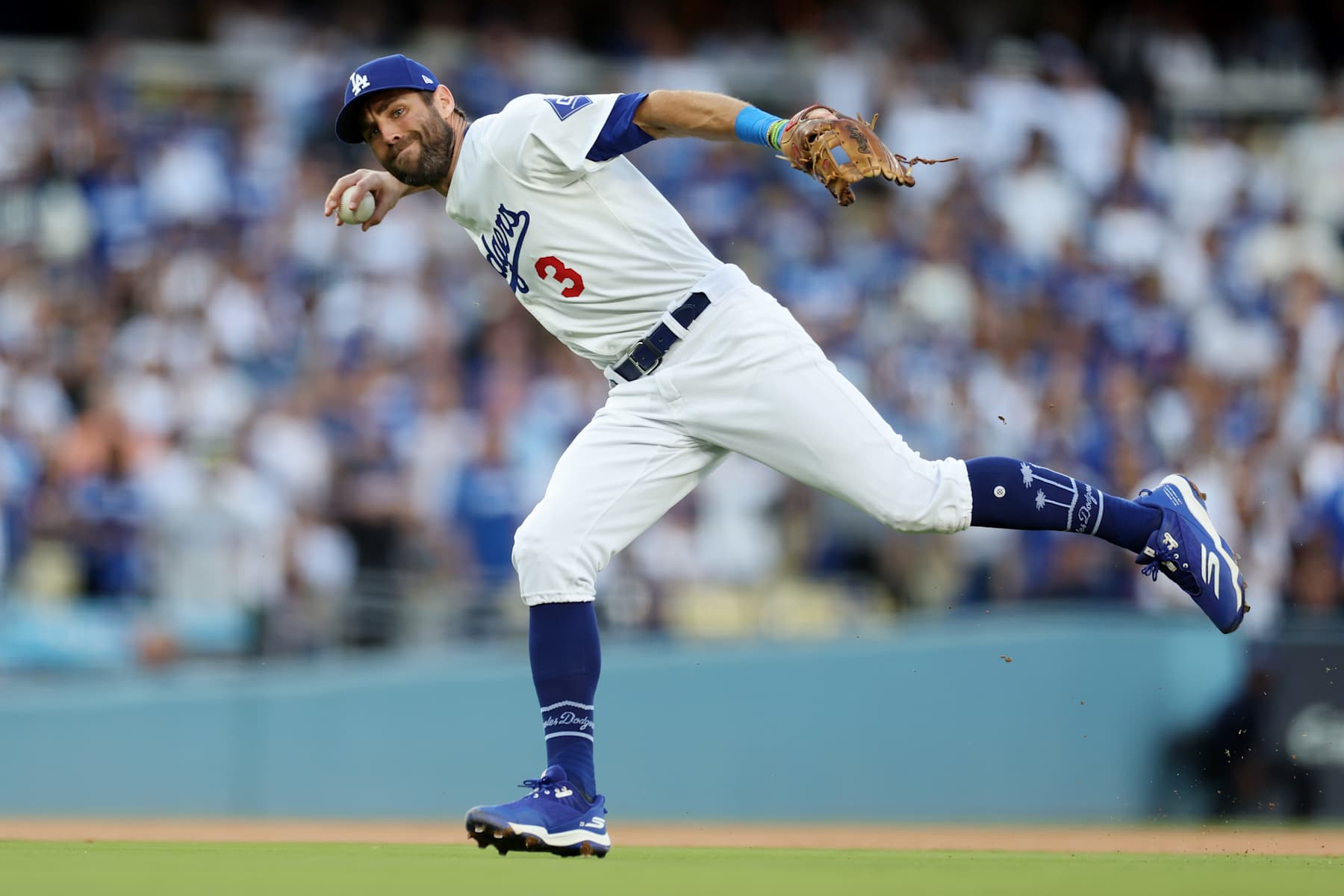 LOS ANGELES, CALIFORNIA - OCTOBER 20:  Chris Taylor #3 of the Los Angeles Dodgers makes a throwing error as he fields a ball off the bat of Pete Alonso #20 of the New York Mets during the 1st inning of Game Six of the National League Championship Series at Dodger Stadium on October 20, 2024 in Los Angeles, California. (Photo by Harry How/Getty Images)