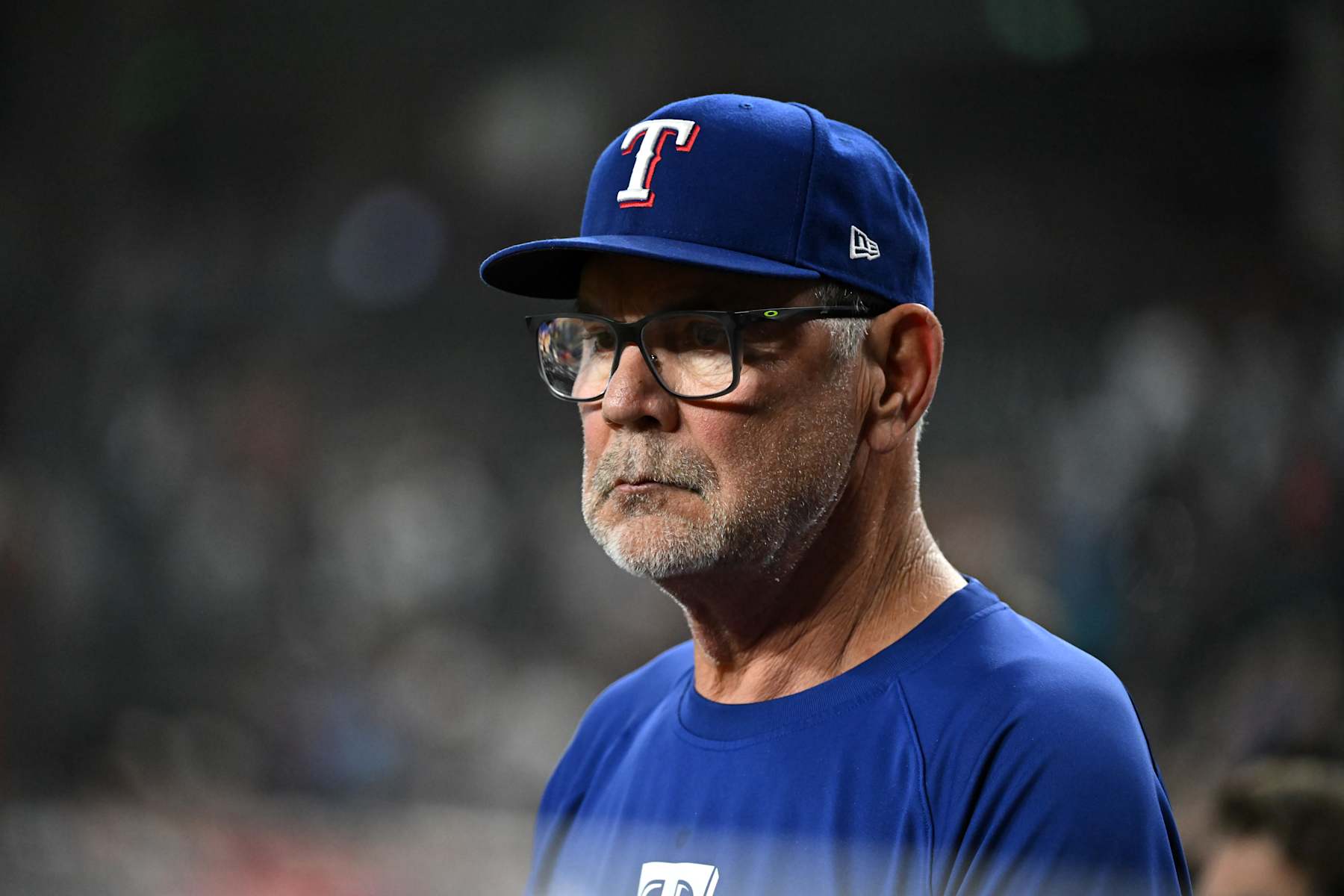 PHOENIX, ARIZONA - SEPTEMBER 11: Manager Bruce Bochy #15 of the Texas Rangers looks on from the bench against the Arizona Diamondbacks at Chase Field on September 11, 2024 in Phoenix, Arizona. (Photo by Norm Hall/Getty Images)