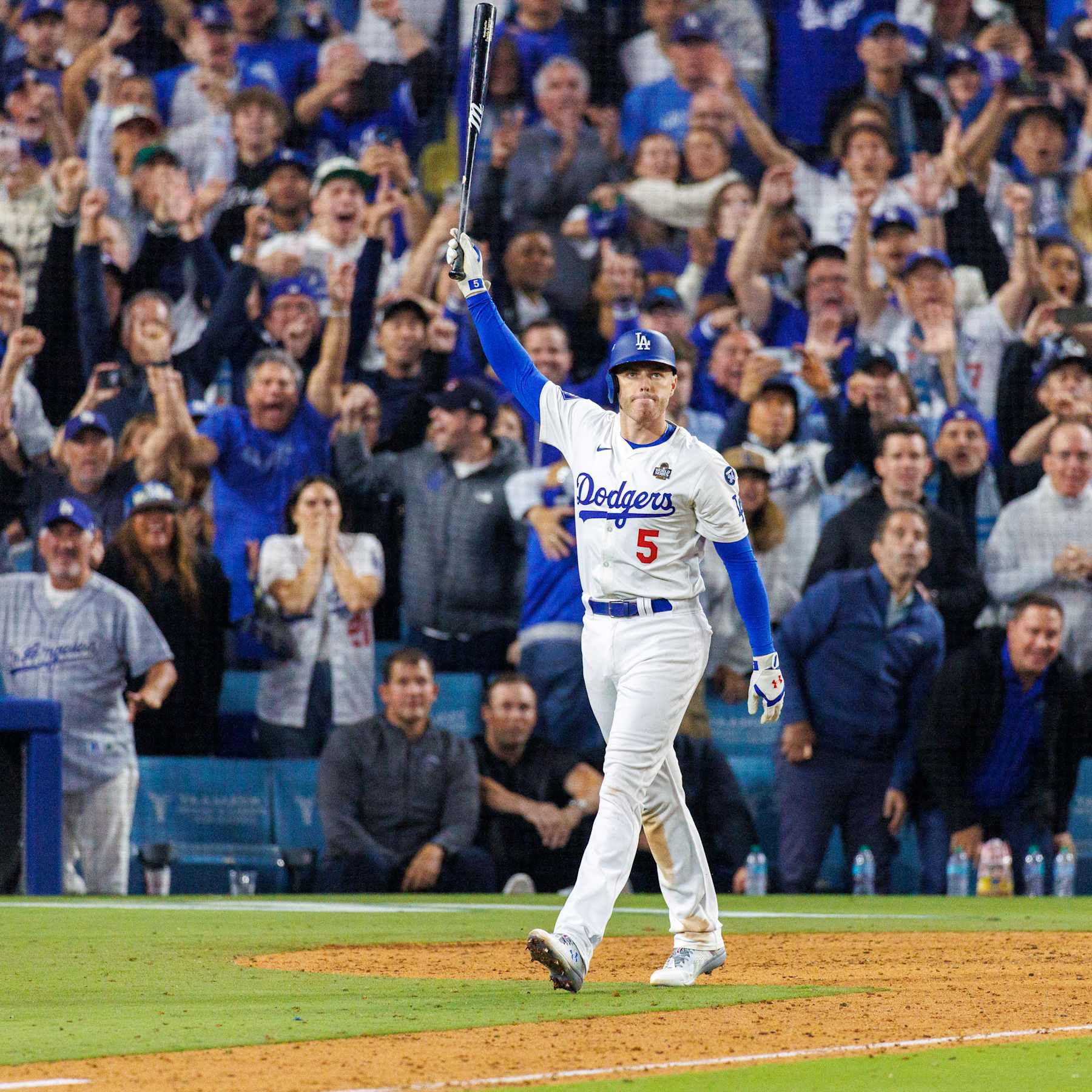 LOS ANGELES, CA - OCTOBER 25, 2024: Los Angeles Dodgers first base Freddie Freeman (5) reacts after hitting a walk-off grand slam in the 10th inning to beat the Yankees 6-3 in Game 1 of the World Series at Dodgers Stadium  on October 25,  2024 in Los Angeles, California. (Gina Ferazzi / Los Angeles Times via Getty Images)