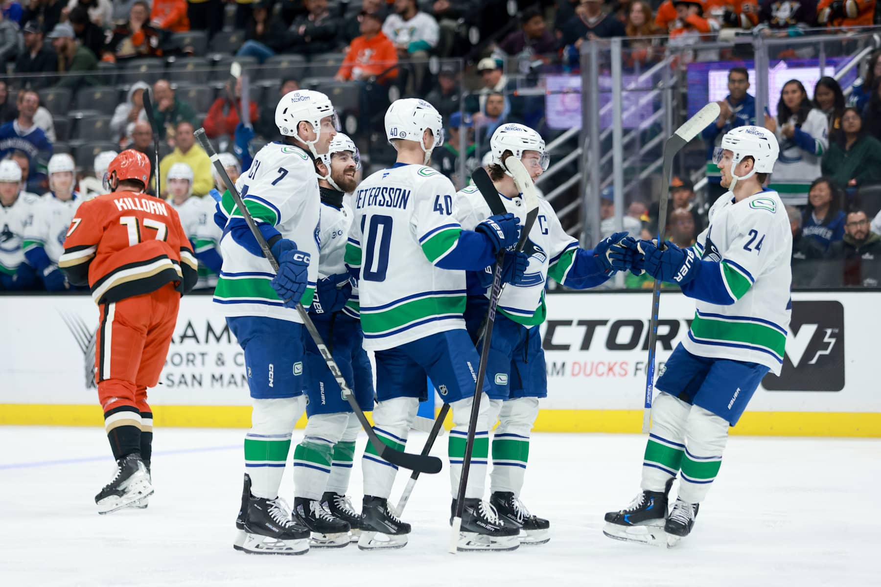 ANAHEIM, CALIFORNIA - NOVEMBER 05: Quinn Hughes #43 of the Vancouver Canucks celebrates scoring a goal with teammates Pius Suter #24, Elias Pettersson #40 and Carson Soucy #7 in the second period during the game against the Anaheim Ducks at Honda Center on November 05, 2024 in Anaheim, California. (Photo by Nicole Vasquez /NHLI via Getty Images)