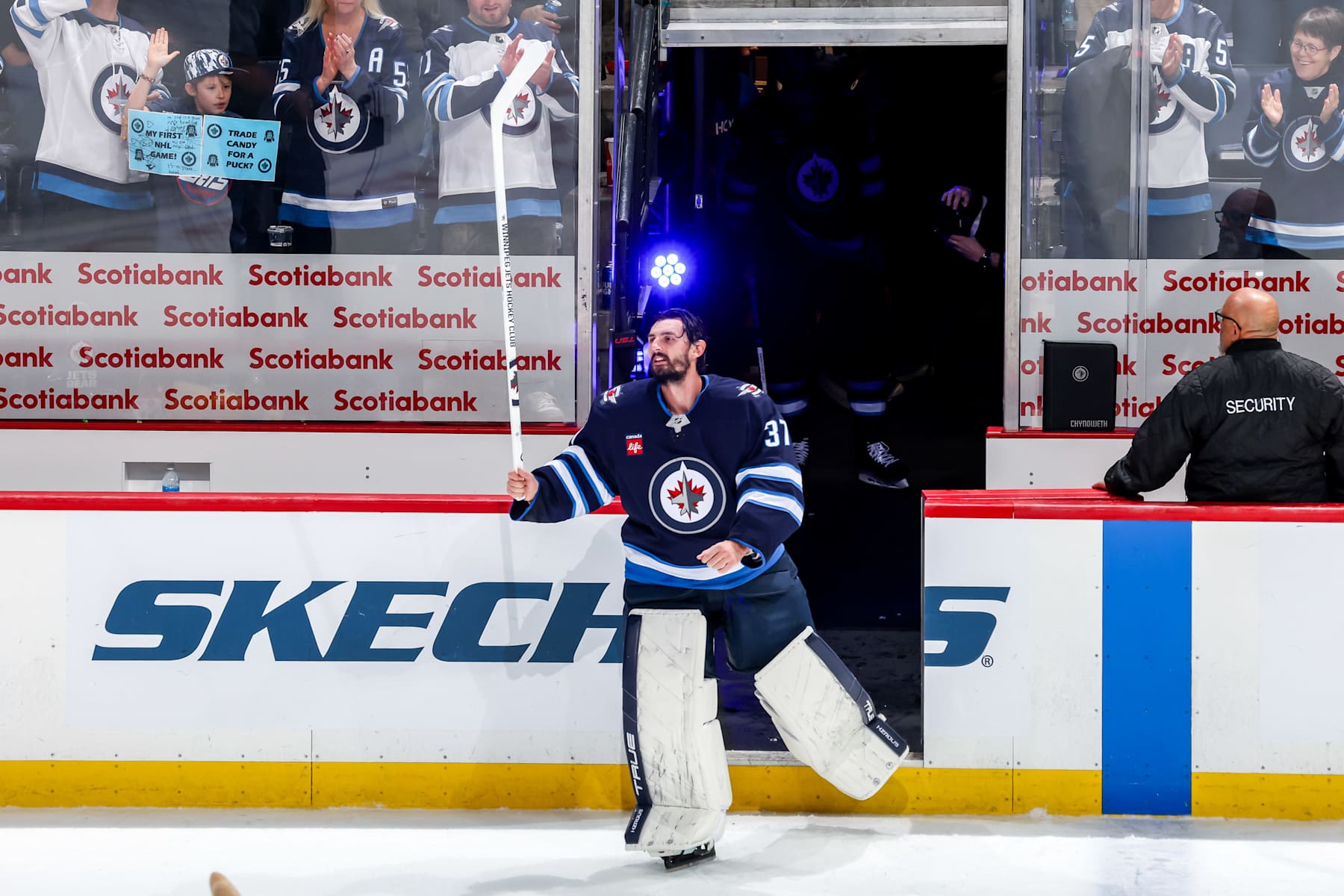 WINNIPEG, CANADA - NOVEMBER 5: Goaltender Connor Hellebuyck #37 of the Winnipeg Jets hits the ice after receiving second star honours following a 3-0 shutout victory over the Utah Hockey Club at the Canada Life Centre on November 5, 2024 in Winnipeg, Manitoba, Canada. This marks the 39th career shutout for Hellebuyck. (Photo by Jonathan Kozub/NHLI via Getty Images)