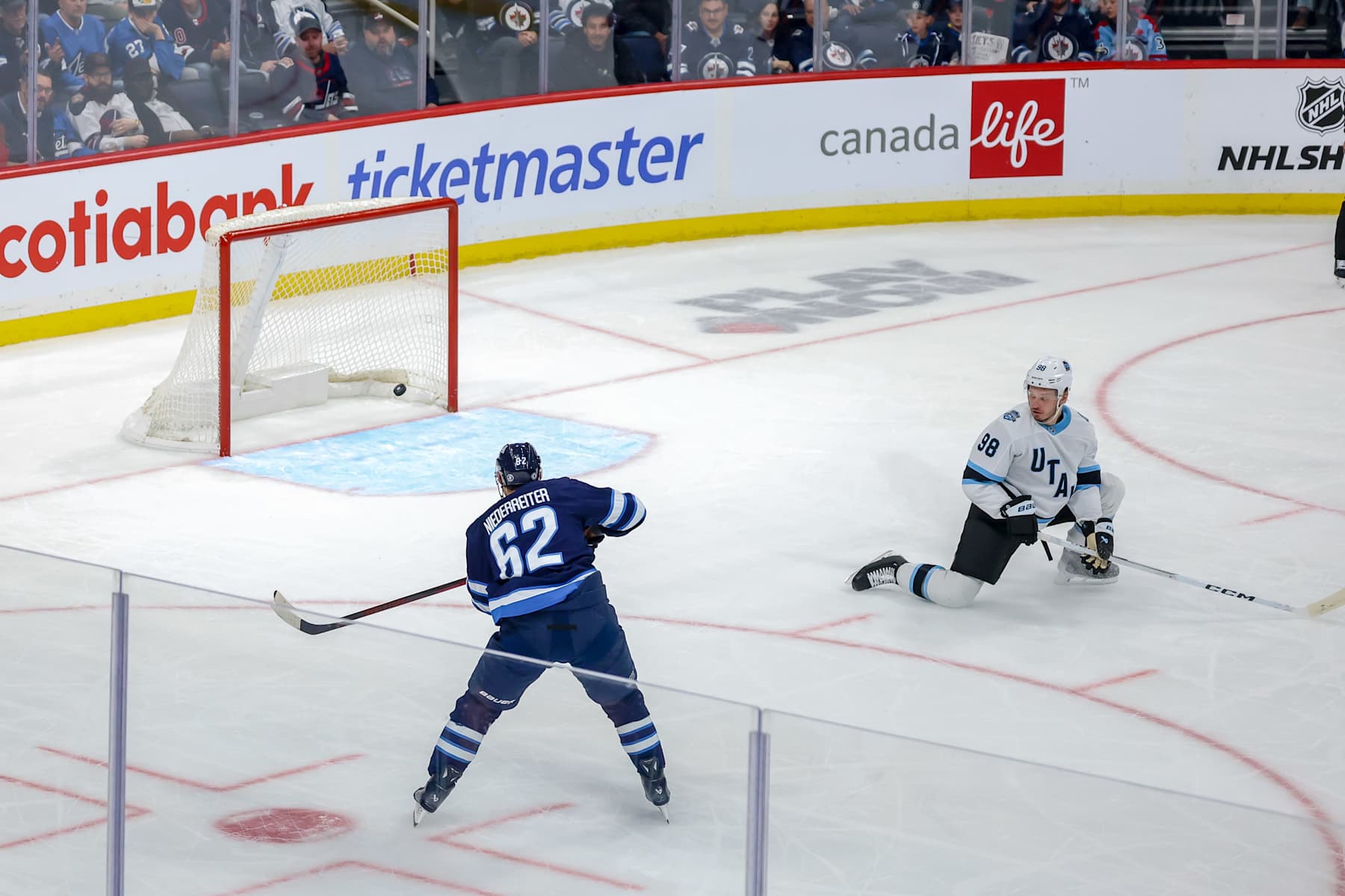 WINNIPEG, CANADA - NOVEMBER 5: Nino Niederreiter #62 of the Winnipeg Jets scores a third period empty net goal against the Utah Hockey Club at the Canada Life Centre on November 5, 2024 in Winnipeg, Manitoba, Canada. (Photo by Jonathan Kozub/NHLI via Getty Images)