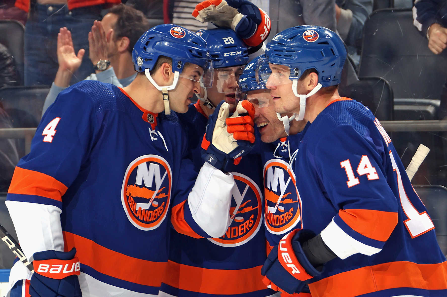 ELMONT, NEW YORK - APRIL 17: (L-R) Samuel Bolduc #4, Alexander Romanov #28, Casey Cizikas #53 and Bo Horvat #14 of the New York Islanders celebrate a second period goal by Cizikas against the Pittsburgh Penguins at UBS Arena on April 17, 2024 in Elmont, New York. (Photo by Bruce Bennett/Getty Images)