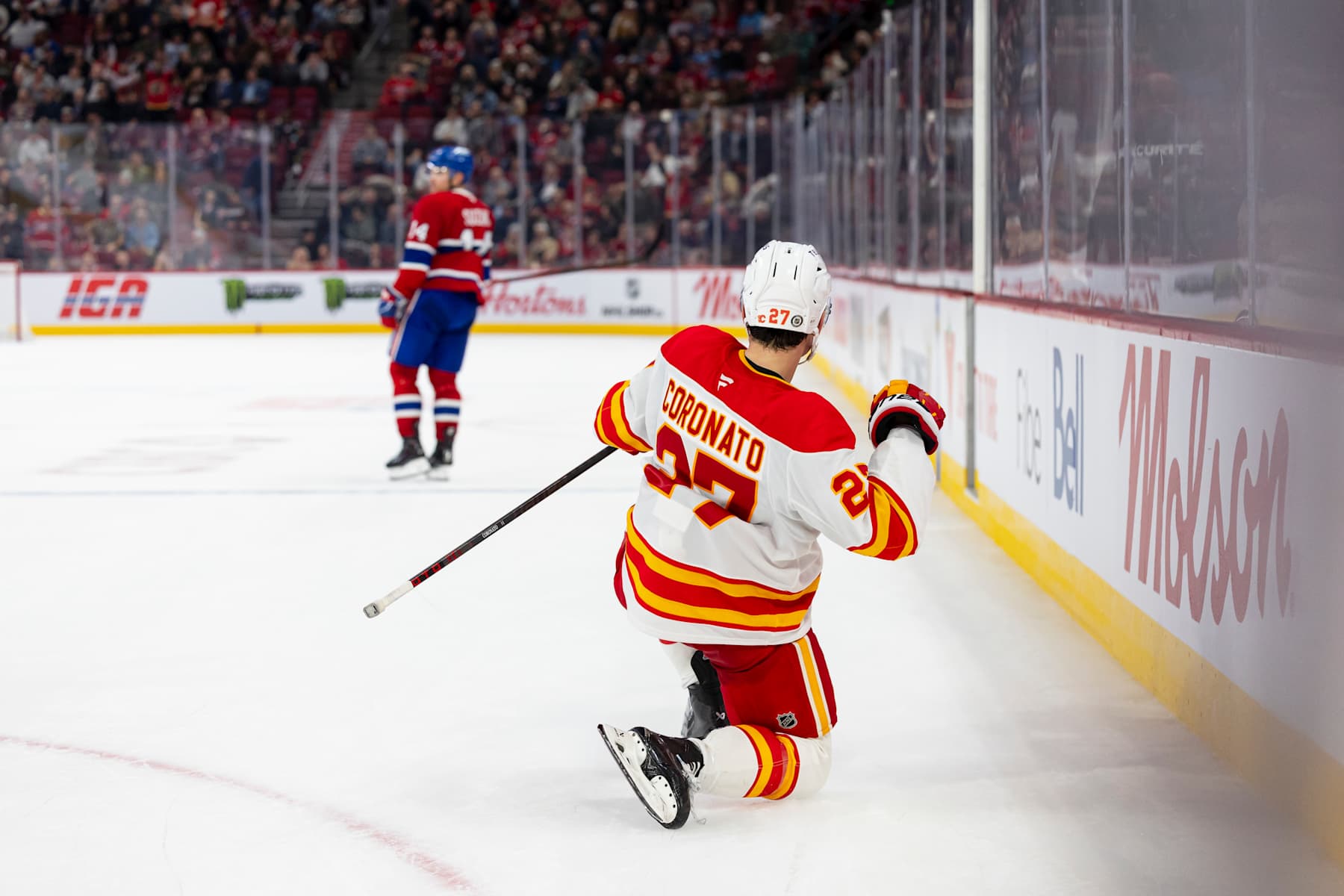 MONTREAL, CANADA- NOVEMBER 5: Matt Coronato #27 of the Calgary Flames celebrates the overtime winner during the overtime period of NHL regular season game between the Montreal Canadiens and the Calgary Flames at the Bell Centre on November 5, 2024 in Montreal, Quebec, Canada. (Photo by Vitor Munhoz/NHLI via Getty Images)