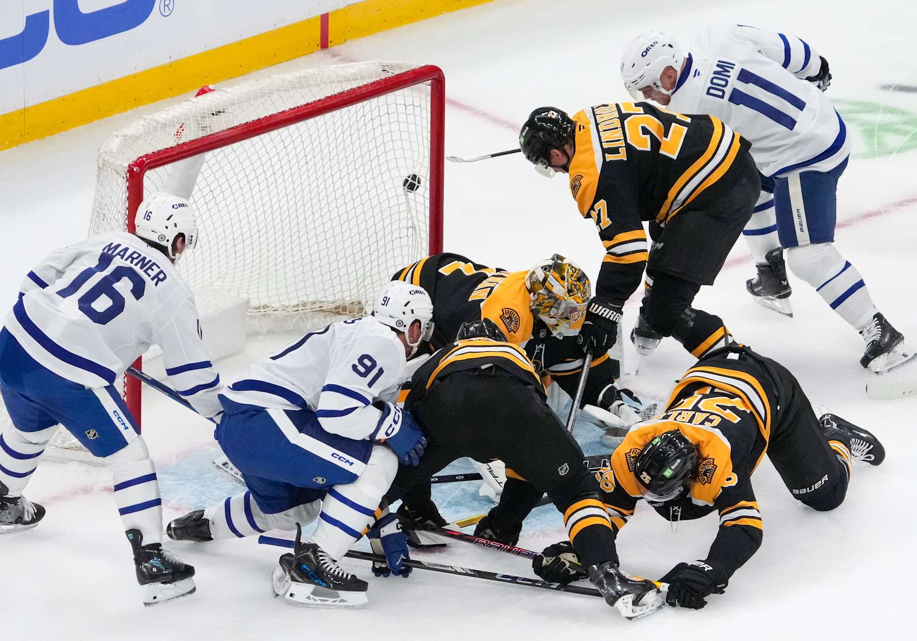 Boston, MA - October 26: A shot by Toronto Maple Leafs C Max Domi goes wide of the net during a scrum in the crease on Toronto power play in the first period. (Photo by Barry Chin/The Boston Globe via Getty Images)