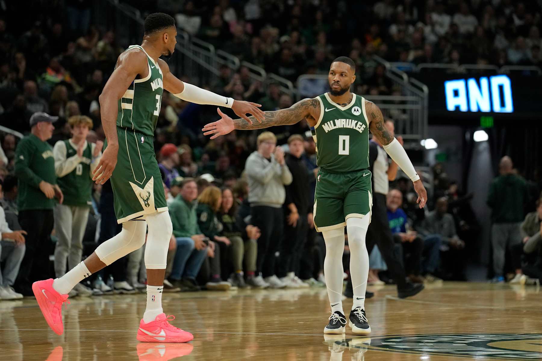 MILWAUKEE, WISCONSIN - NOVEMBER 02: Giannis Antetokounmpo #34 and Damian Lillard #0 of the Milwaukee Bucks react after a basket against the Cleveland Cavaliers during the first quarter of a game at Fiserv Forum on November 02, 2024 in Milwaukee, Wisconsin. NOTE TO USER: User expressly acknowledges and agrees that, by downloading and or using this photograph, User is consenting to the terms and conditions of the Getty Images License Agreement. (Photo by Patrick McDermott/Getty Images)