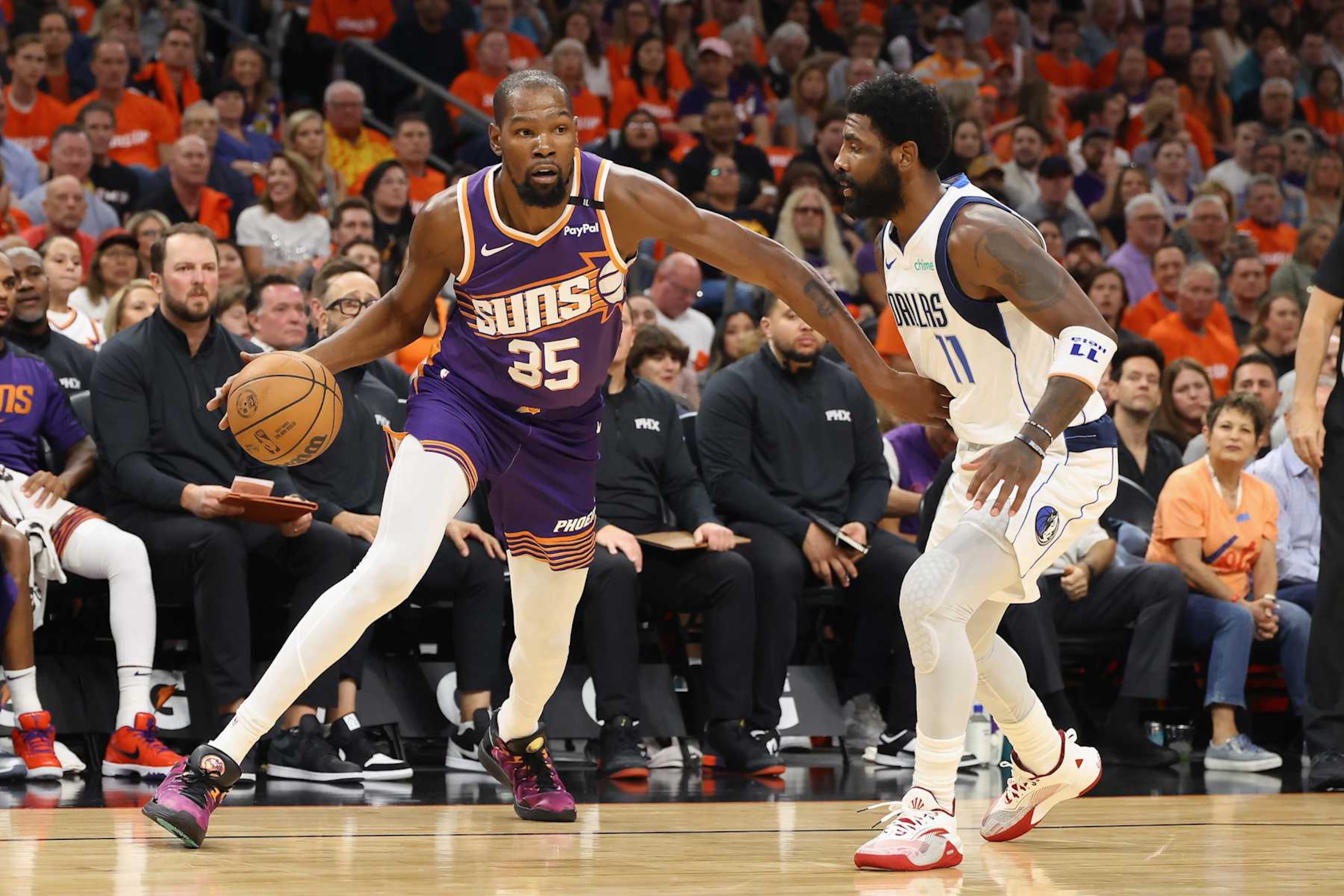 PHOENIX, ARIZONA - OCTOBER 26: Kevin Durant #35 of the Phoenix Suns handles the ball against Kyrie Irving #11 of the Dallas Mavericks during the NBA game at Footprint Center on October 26, 2024 in Phoenix, Arizona. The Suns defeated the Mavericks 114-102.  NOTE TO USER: User expressly acknowledges and agrees that, by downloading and/or using this photograph, user is consenting to the terms and conditions of the Getty Images License Agreement. (Photo by Christian Petersen/Getty Images)