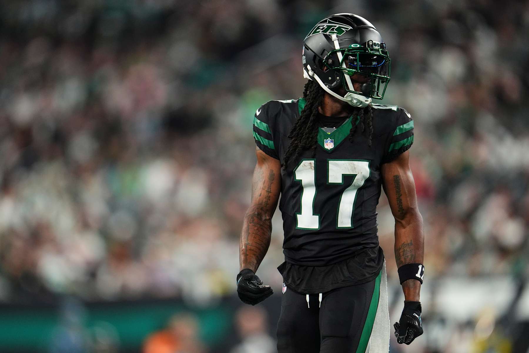 EAST RUTHERFORD, NJ - OCTOBER 31: Davante Adams #17 of the New York Jets looks on from the field during an NFL football game against the Houston Texans at MetLife Stadium on October 31, 2024 in East Rutherford, New Jersey. (Photo by Cooper Neill/Getty Images)