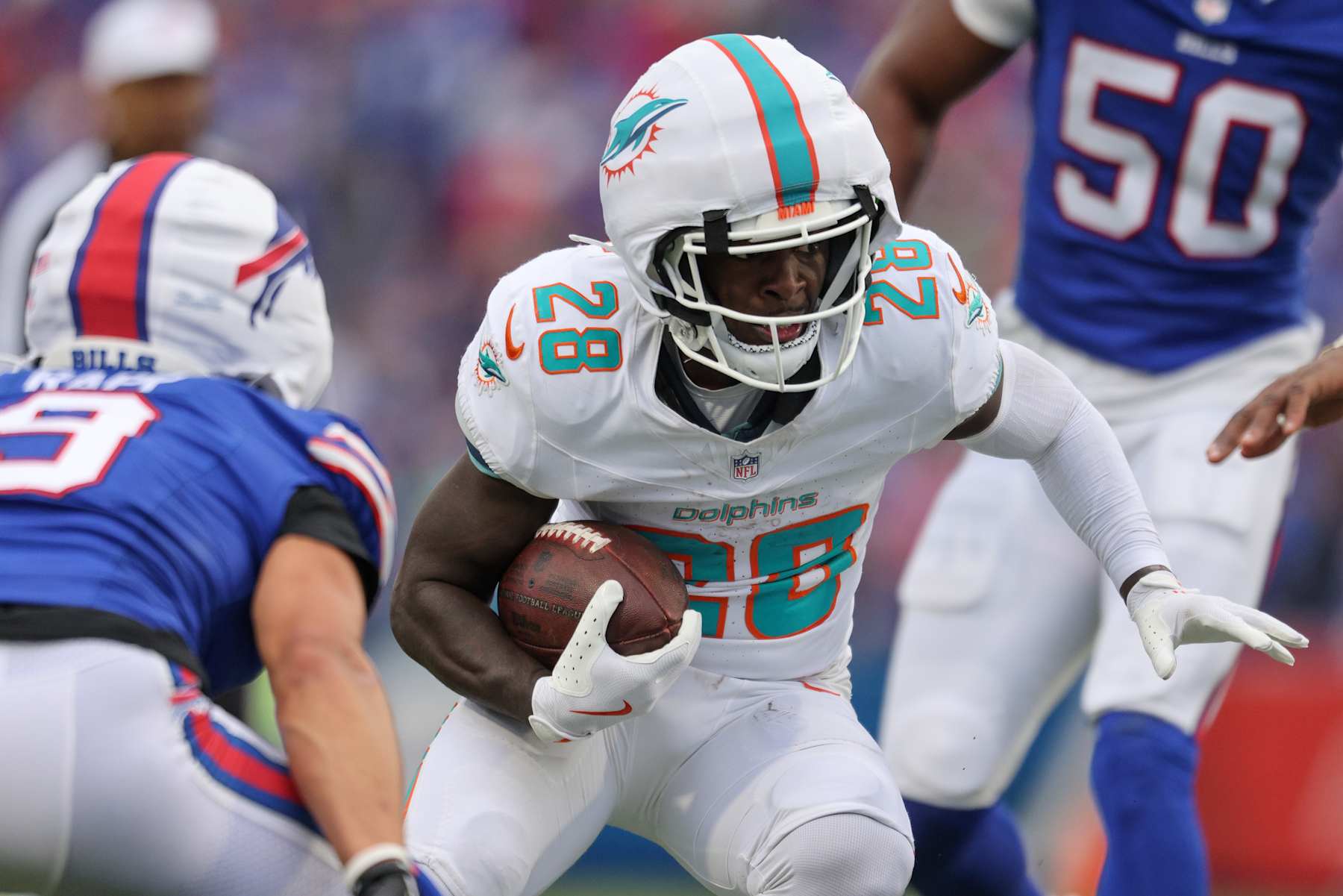 ORCHARD PARK, NEW YORK - NOVEMBER 03: De'Von Achane #28 of the Miami Dolphins runs the ball during the third quarter against the Buffalo Bills at Highmark Stadium on November 03, 2024 in Orchard Park, New York. (Photo by Bryan Bennett/Getty Images)