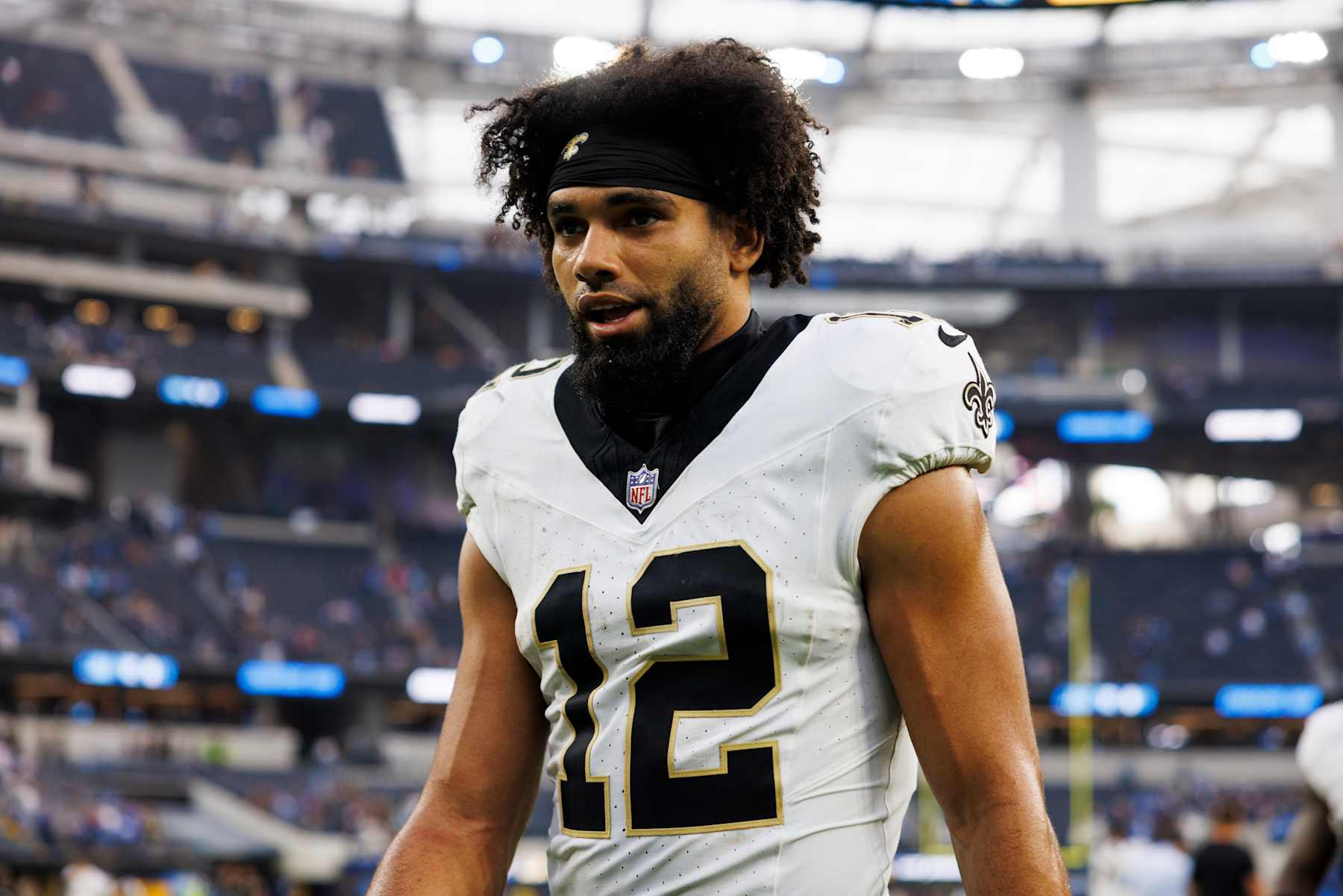 INGLEWOOD, CALIFORNIA - OCTOBER 27: Chris Olave #12 of the New Orleans Saints walks off the field after the game against the Los Angeles Chargers at SoFi Stadium on October 27, 2024 in Inglewood, California. (Photo by Ric Tapia/Getty Images)