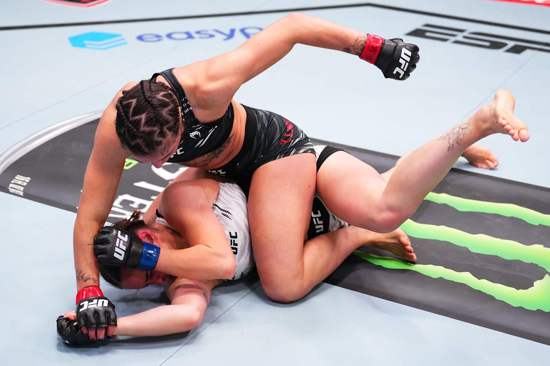 LAS VEGAS, NEVADA - NOVEMBER 09: (R-L) Melissa Mullins of England punches Klaudia Sygula of Poland in a bantamweight fight during the UFC Fight Night event at UFC APEX on November 09, 2024 in Las Vegas, Nevada. (Photo by Chris Unger/Zuffa LLC)