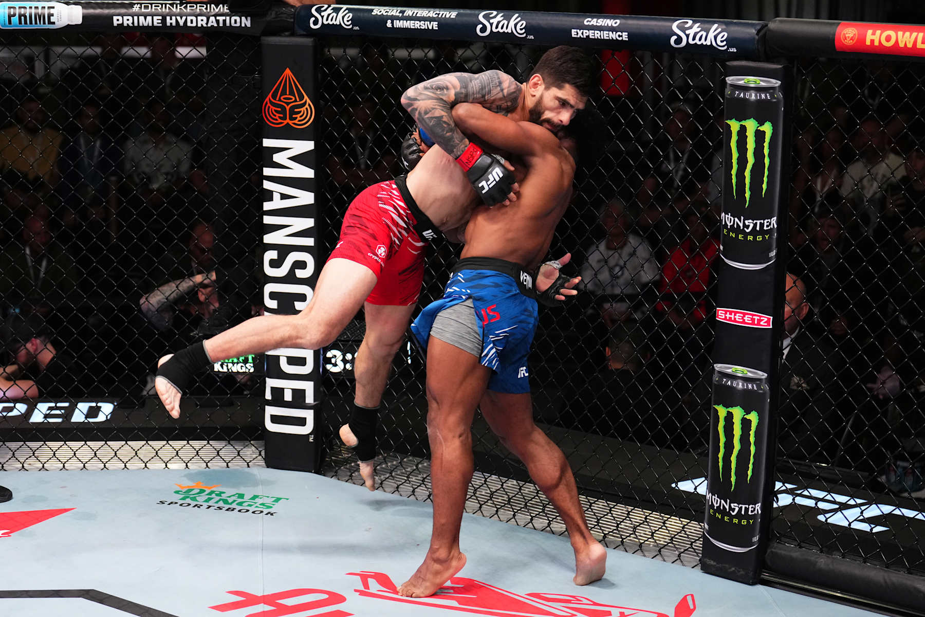 LAS VEGAS, NEVADA - NOVEMBER 09: (R-L) Cortavious Romious takes down Gaston Bolanos of Peru in a bantamweight fight during the UFC Fight Night event at UFC APEX on November 09, 2024 in Las Vegas, Nevada. (Photo by Chris Unger/Zuffa LLC)