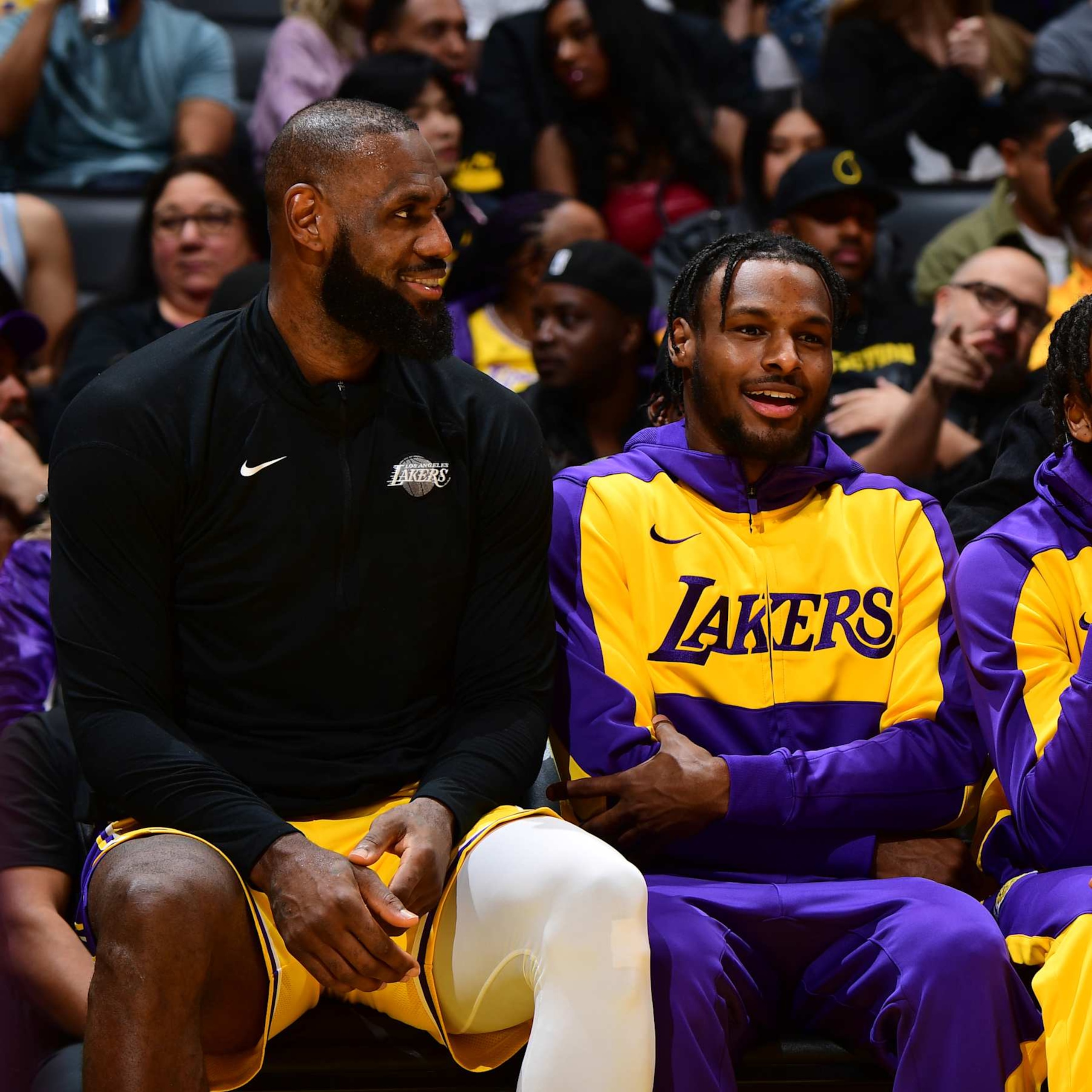 LOS ANGELES, CA - NOVEMBER 8: LeBron James #23 and Bronny James #9 of the Los Angeles Lakers talk during the game against the Philadelphia 76ers on Novemberr 8, 2024 at Crypto.Com Arena in Los Angeles, California. NOTE TO USER: User expressly acknowledges and agrees that, by downloading and/or using this Photograph, user is consenting to the terms and conditions of the Getty Images License Agreement. Mandatory Copyright Notice: Copyright 2024 NBAE (Photo by Adam Pantozzi/NBAE via Getty Images)