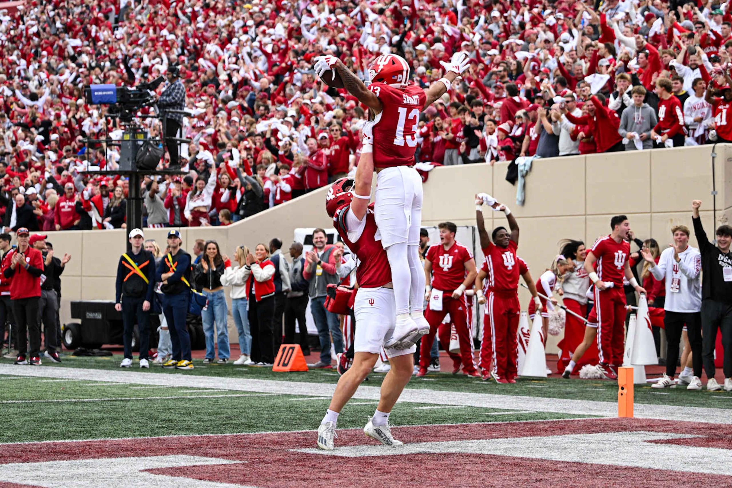 BLOOMINGTON, IN - NOVEMBER 09: Indiana Hoosiers TE Zach Horton (44) holds Indiana Hoosiers WR Elijah Sarratt (13) in the air while celebrating a touchdown during a college football game between the Michigan Wolverines and Indiana Hoosiers on November 9, 2024 at Memorial Stadium in Bloomington, IN (Photo by James Black/Icon Sportswire via Getty Images) BLOOMINGTON, IN - NOVEMBER 09: Indiana Hoosiers TE Zach Horton (44) holds Indiana Hoosiers WR Elijah Sarratt (13) in the air while celebrating a touchdown during a college football game between the Michigan Wolverines and Indiana Hoosiers on November 9, 2024 at Memorial Stadium in Bloomington, IN (Photo by James Black/Icon Sportswire via Getty Images)