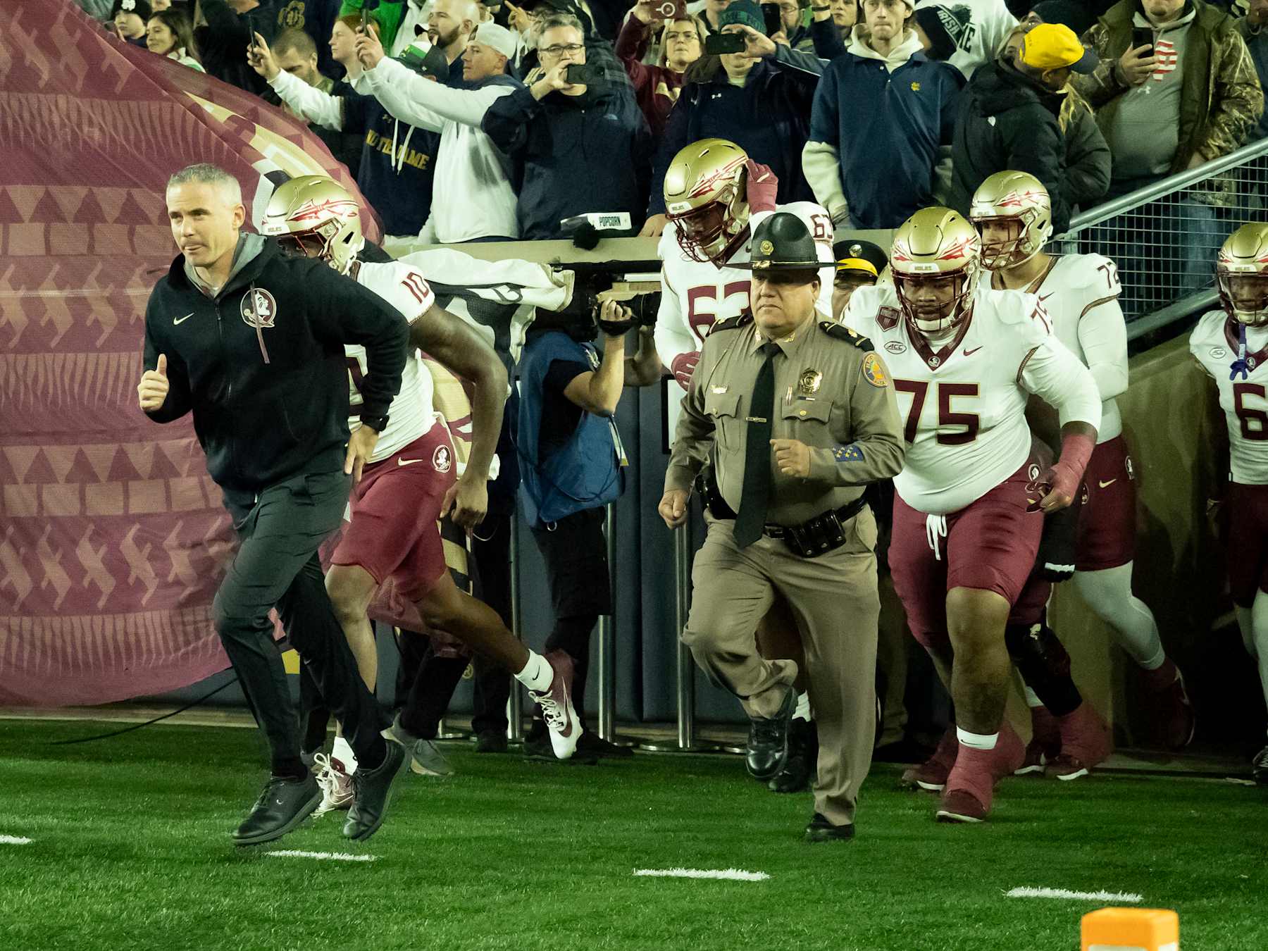 SOUTH BEND, IN - NOVEMBER 09: Florida State Seminoles head coach Mike Norvell leads his team onto the field before the game between the Notre Dame Fighting Irish and the  Florida State Seminoles at Notre Dame Stadium in South Bend, IN on November 9 2024. (Photo by Joseph Weiser/Icon Sportswire via Getty Images)