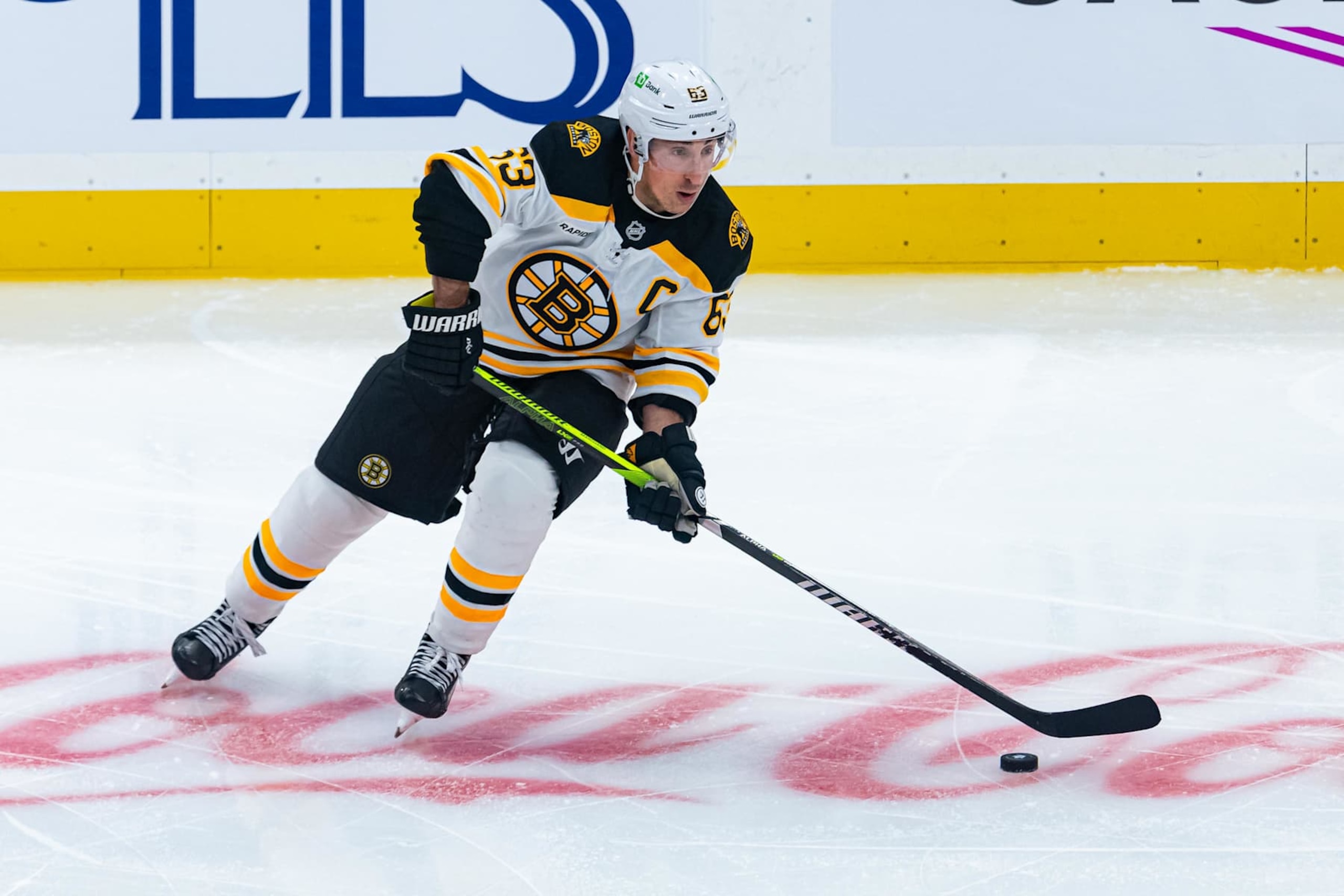 TORONTO, ON - NOVEMBER 05: Boston Bruins Left Wing Brad Marchand (63) skates with the puck during the NHL regular season game between the Boston Bruins and the Toronto Maple Leafs on November 5, 2024, at Scotiabank Arena in Toronto, ON, Canada. (Photo by Julian Avram/Icon Sportswire via Getty Images)