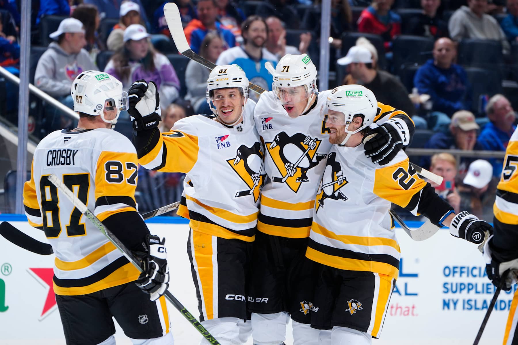 ELMONT, NEW YORK - NOVEMBER 05:  Evgeni Malkin #71 of the Pittsburgh Penguins is congratulated by his teammates after scoring a goal against the New York Islanders during the second period at UBS Arena on November 05, 2024 in Elmont, New York. (Photo by Mike Stobe/NHLI via Getty Images)