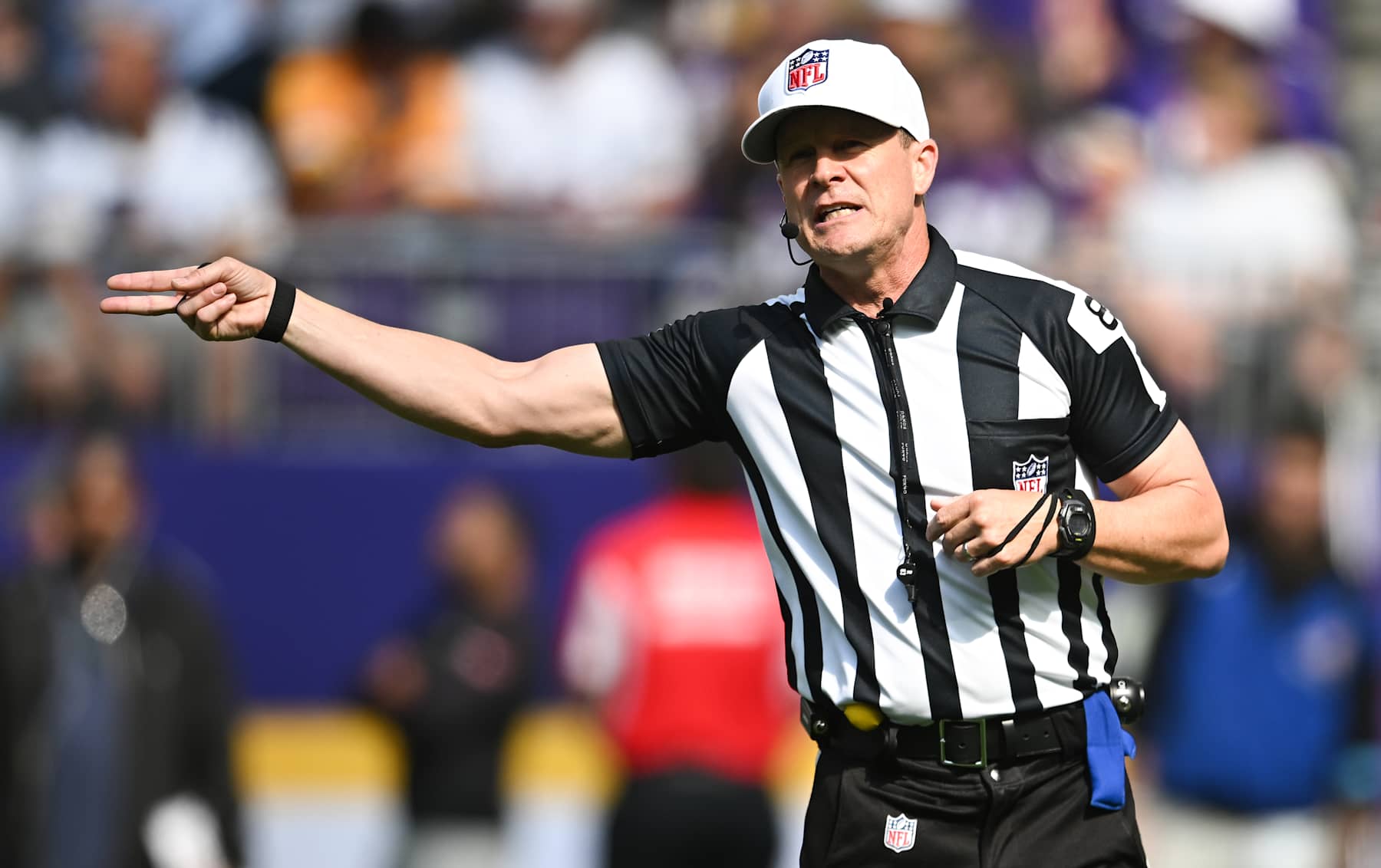 MINNEAPOLIS, MINNESOTA - SEPTEMBER 22: Referee Shawn Hochuli #83 signals for a penalty in the third quarter of the game between the Houston Texans and Minnesota Vikings at U.S. Bank Stadium on September 22, 2024 in Minneapolis, Minnesota. (Photo by Stephen Maturen/Getty Images)