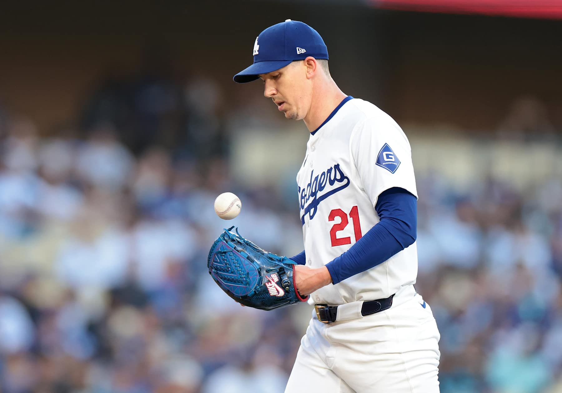 LOS ANGELES CALIFORNIA CALIFORNIA-A Dodgers pitcher Walker Buehler walks back to the mound after giving up a hit against the Rangers at Dodgers Stadium Wednesday. (Wally Skalij/Los Angeles Times via Getty Images)